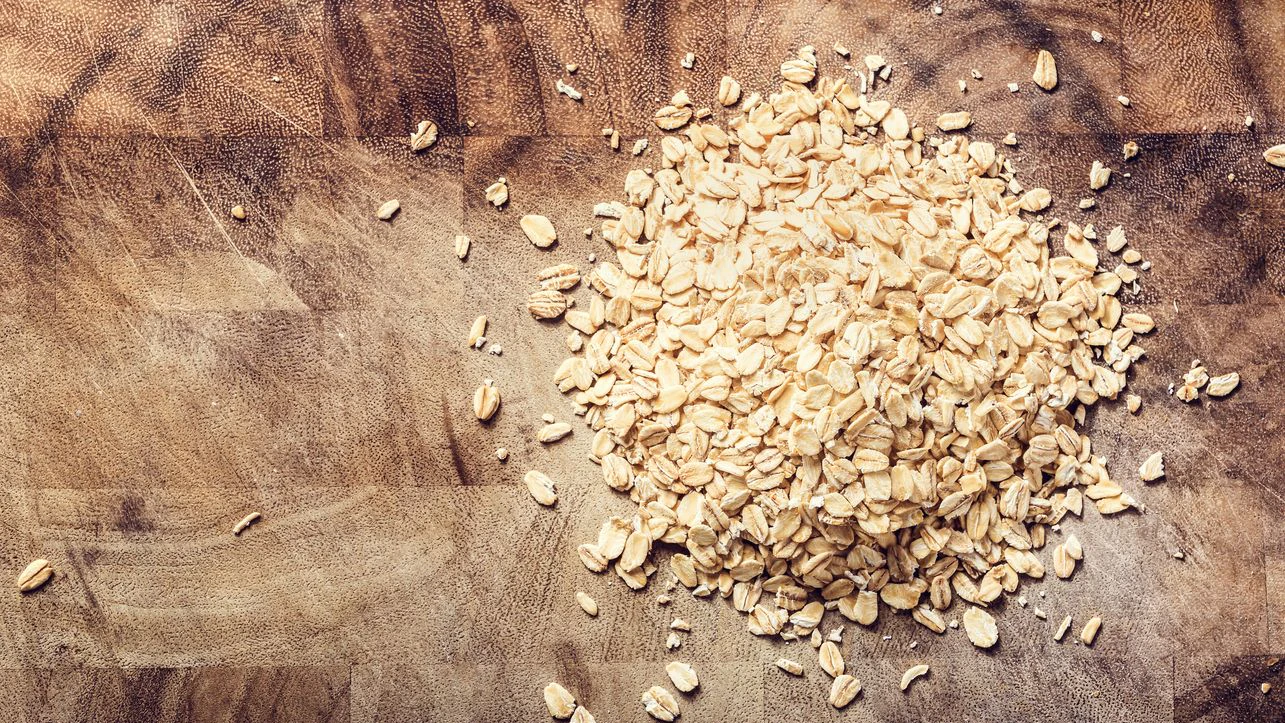 Heap of oatmeal on a wooden rustic table