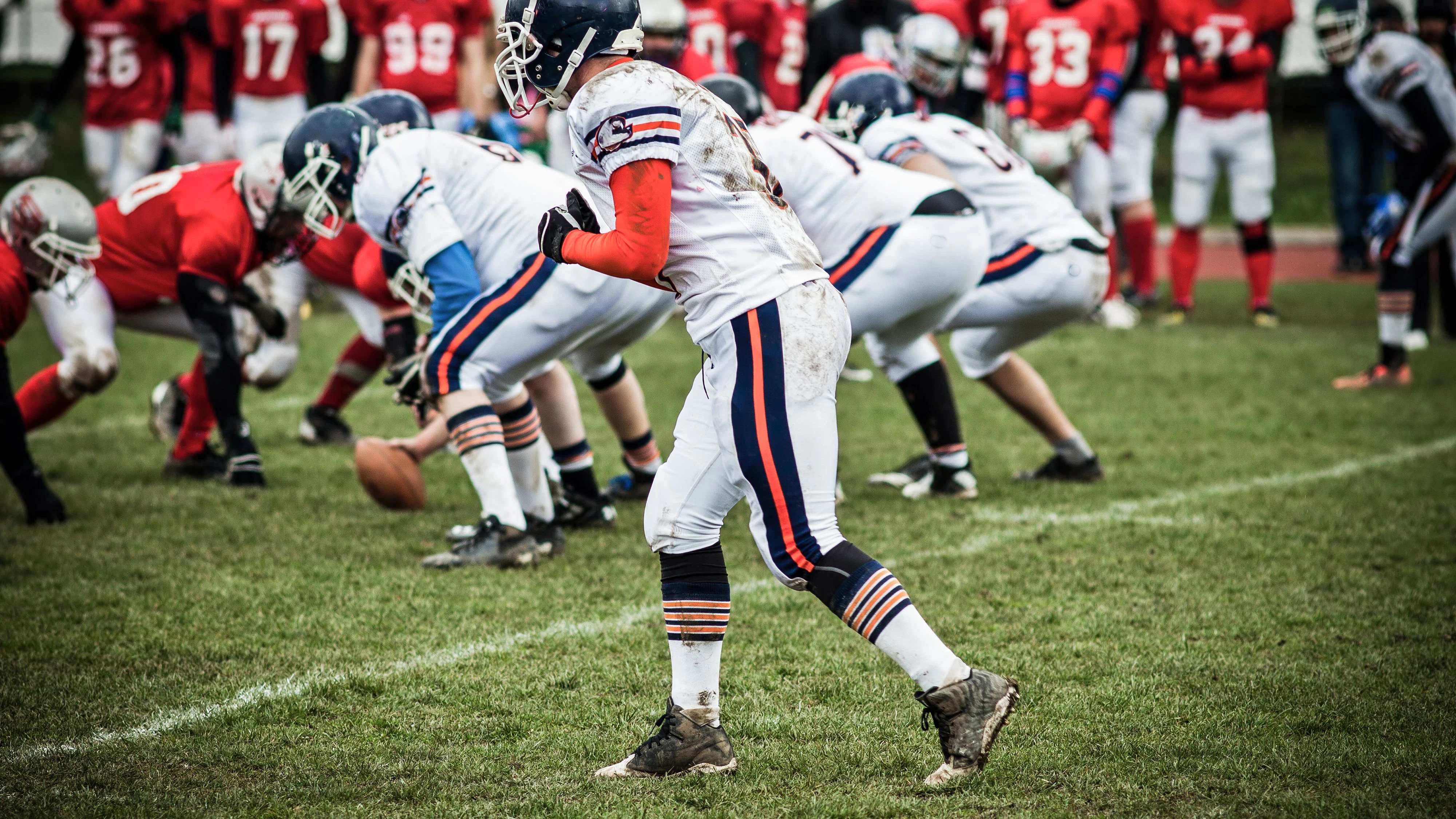 american football players fighting for the ball