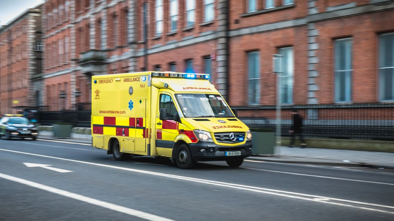 Dublin, Ireland - February 16, 2019: Irish ambulance driving fast on the streets of Dublin on a winter day