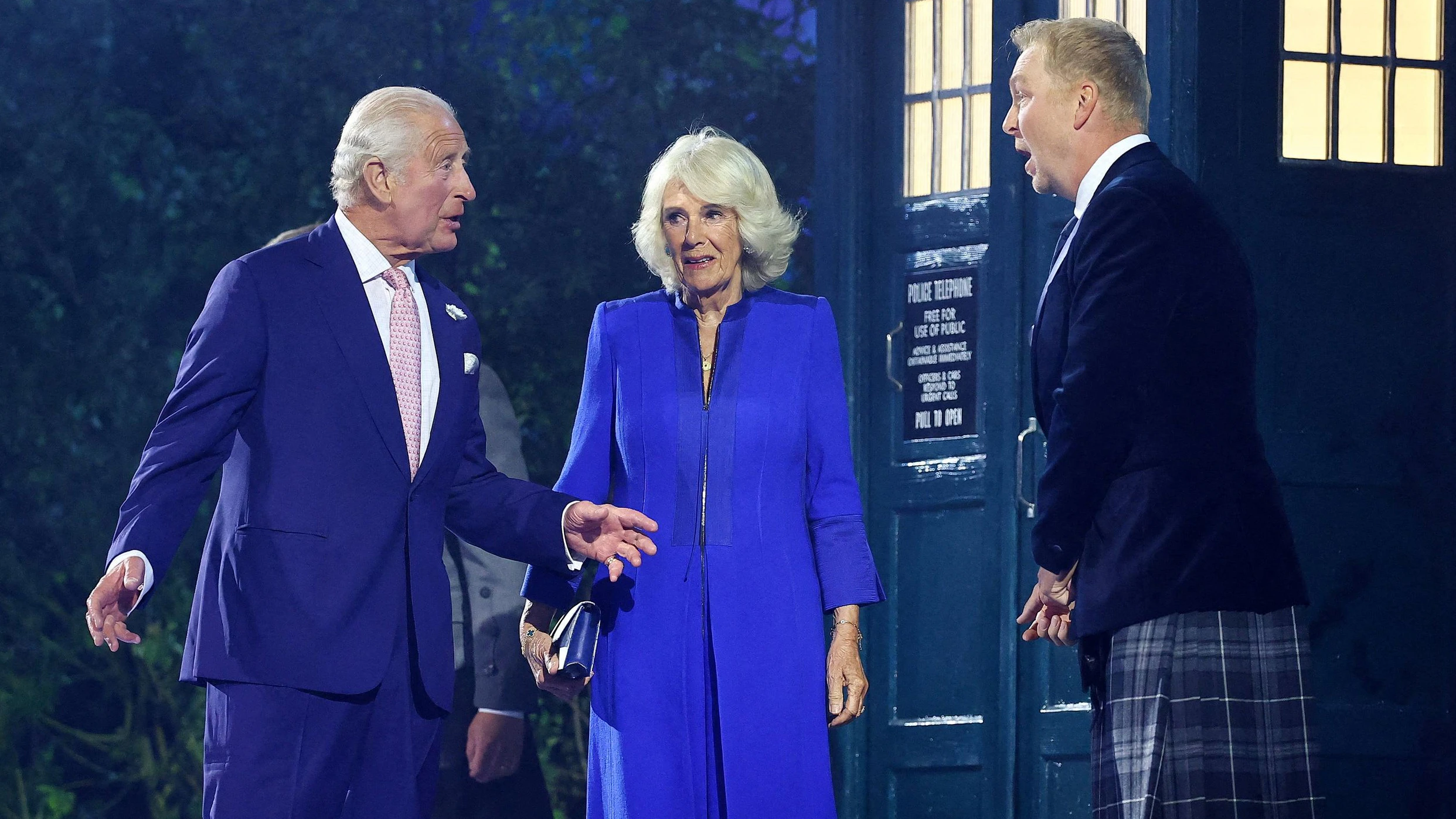 Commonwealth Games 2026 - Opening Ceremony - The Hydro, Glasgow, Scotland, Britain - July 23, 2026Britain's King Charles and Queen Camilla step out of The Tardis from the TV series Doctor Who as former track cyclist Chris Hoy looks on during the opening ceremony 