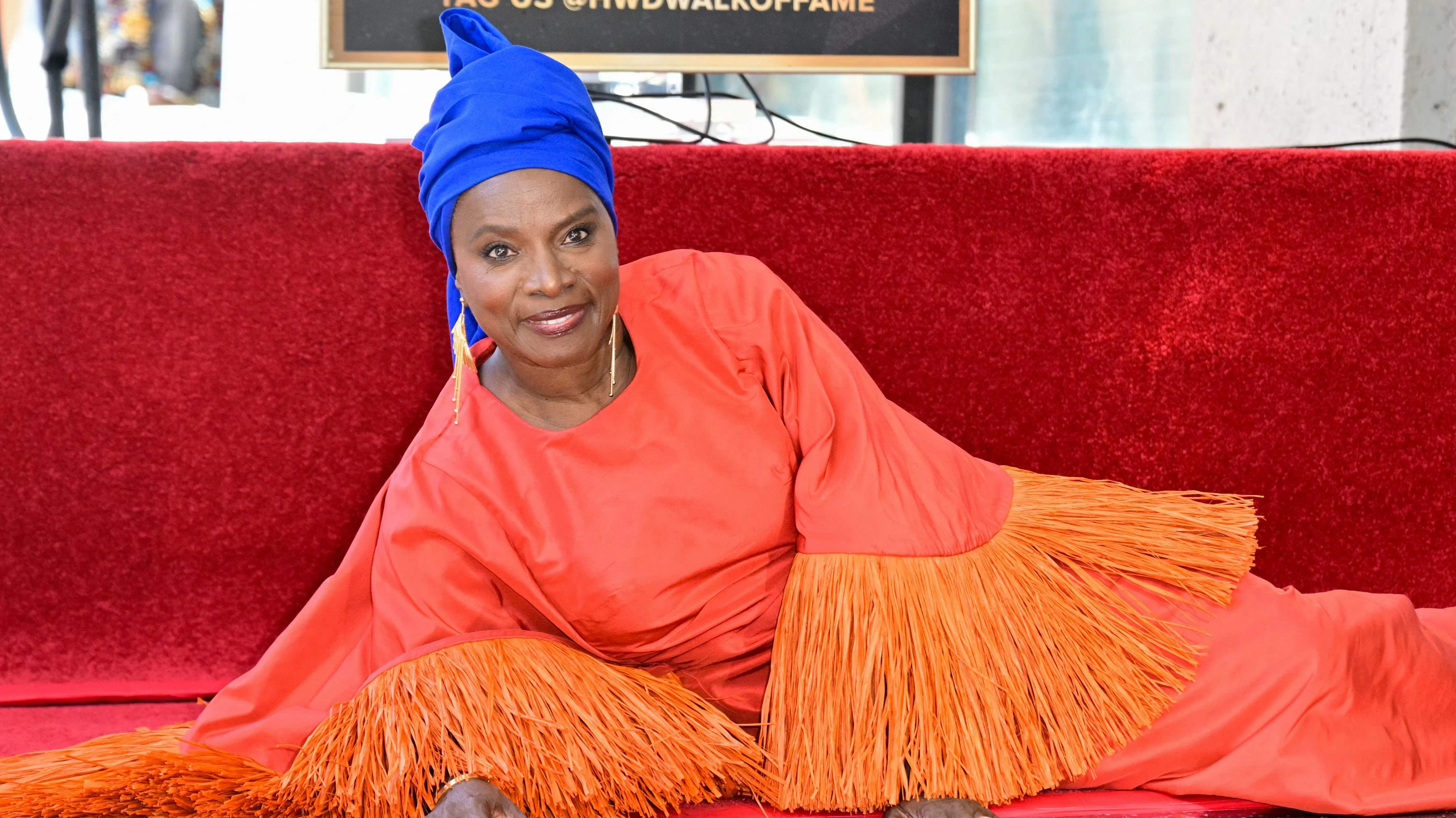 Beninese musician and actress Angelique Kidjo poses next to her newly unveiled star during her Hollywood Walk of Fame star ceremony in the Hollywood neighborhood of Los Angeles on August 18, 2026. (Photo by Frederic J. Brown / AFP)