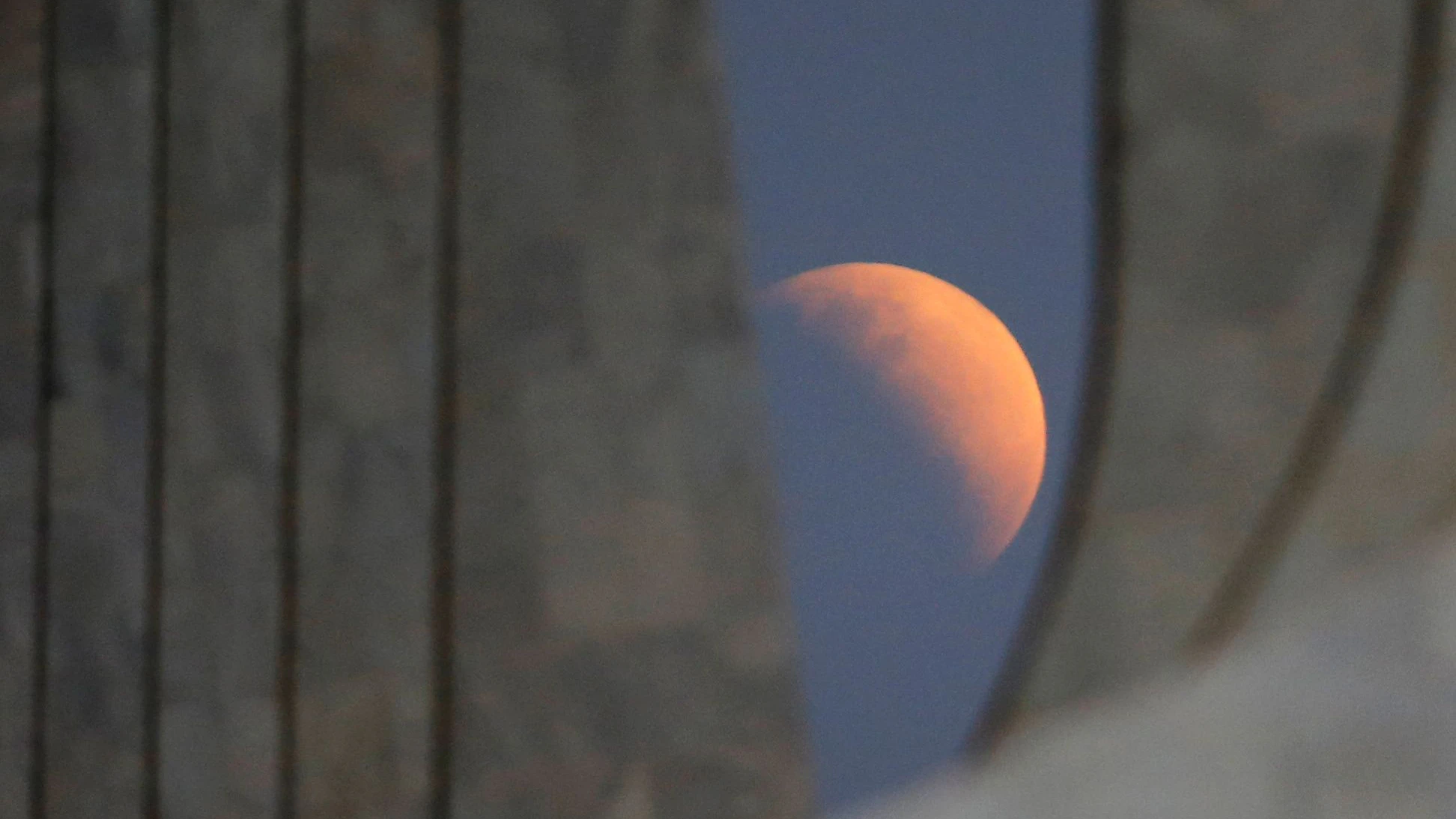 A partial lunar eclipse is seen outside the Planalto Palace in Brasilia, Brazil July 16, 2019. REUTERS/Adriano Machado