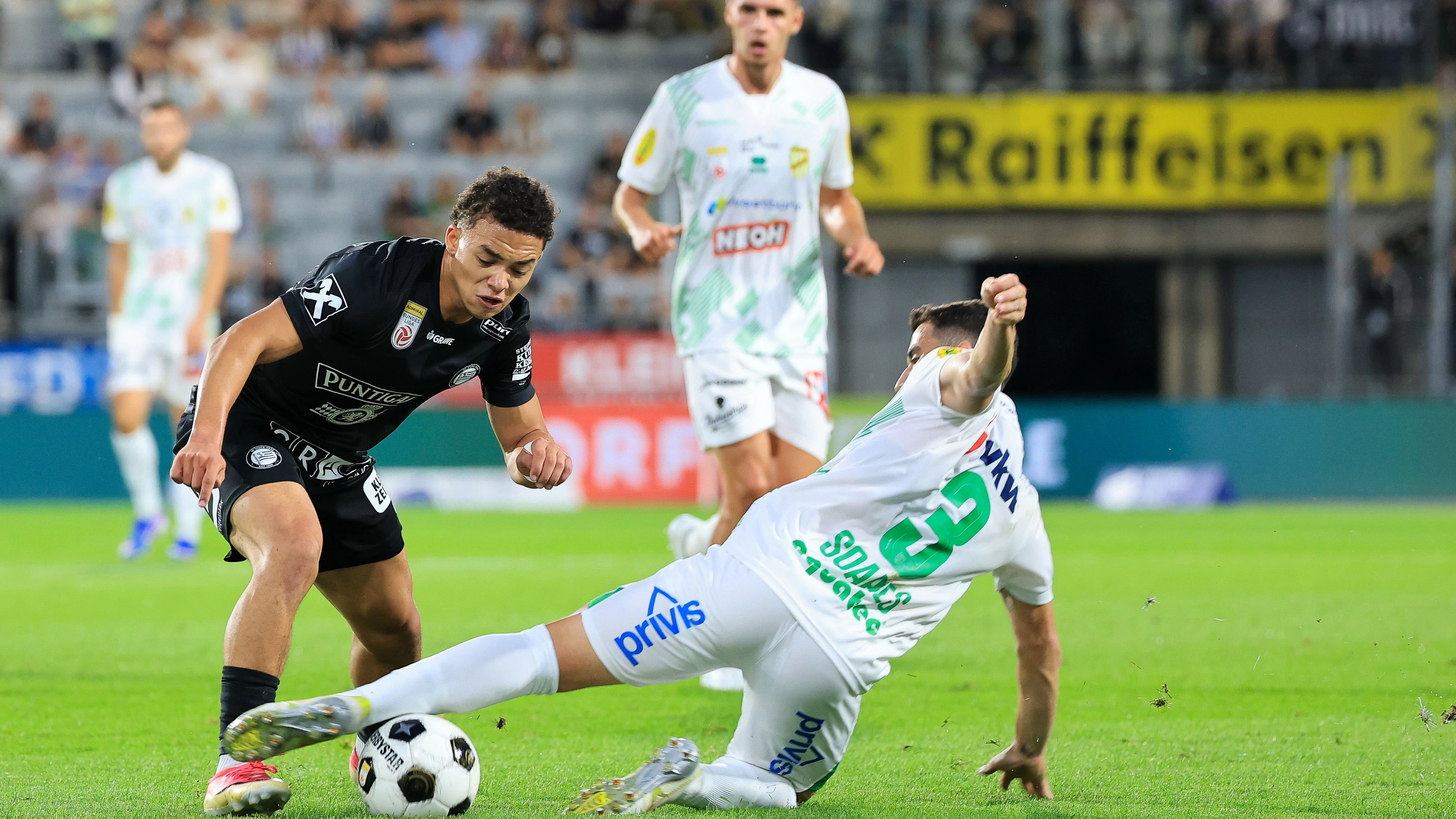 GRAZ,AUSTRIA,22.AUG.26 - SOCCER - ADMIRAL Bundesliga, SK Sturm Graz vs SC Austria Lustenau. Image shows Luca Weinhandl (Sturm) and Danilo Soares (A.Lustenau). Photo: GEPA pictures/ Wolfgang Grebien