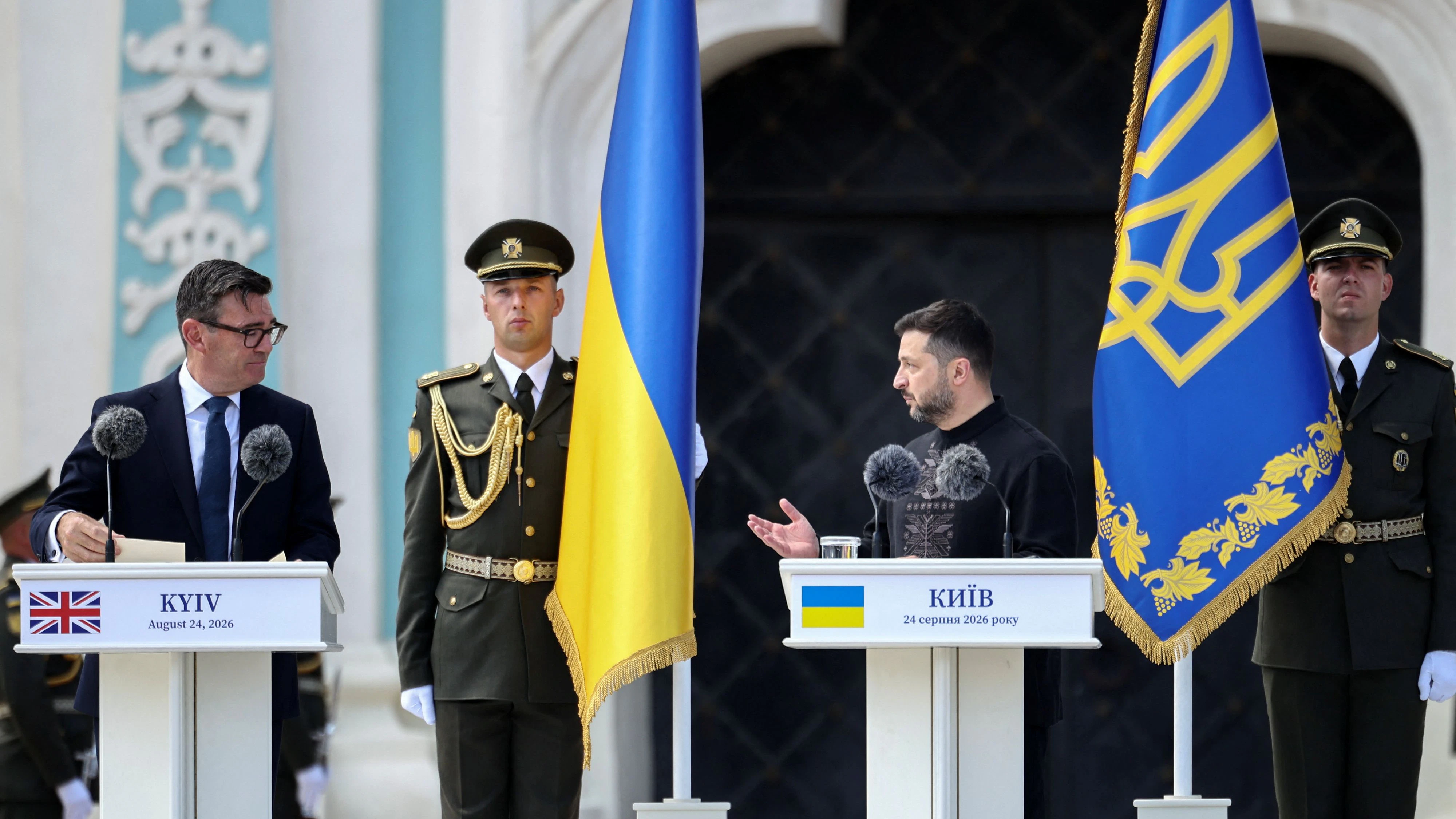 Britain's Prime Minister Andy Burnham looks at Ukraine's President Volodymyr Zelensky deliver a speech during a commemorative ceremony marking Ukraine's 35th Independence Day outside St. Sophia cathedral in Kyiv, Ukraine, August 24, 2026.      HENRY NICHOLLS/Pool via REUTERS