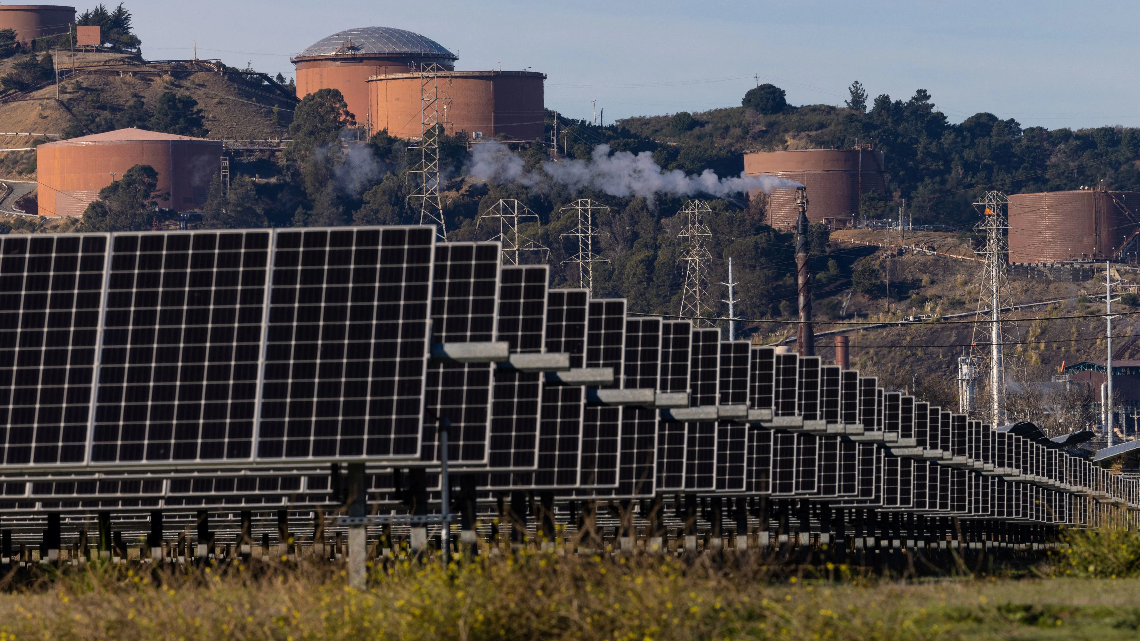 Solar panels are see next to a Chevron refinery installation in Richmond, California, U.S. December 13, 2023. REUTERS/Carlos Barria 