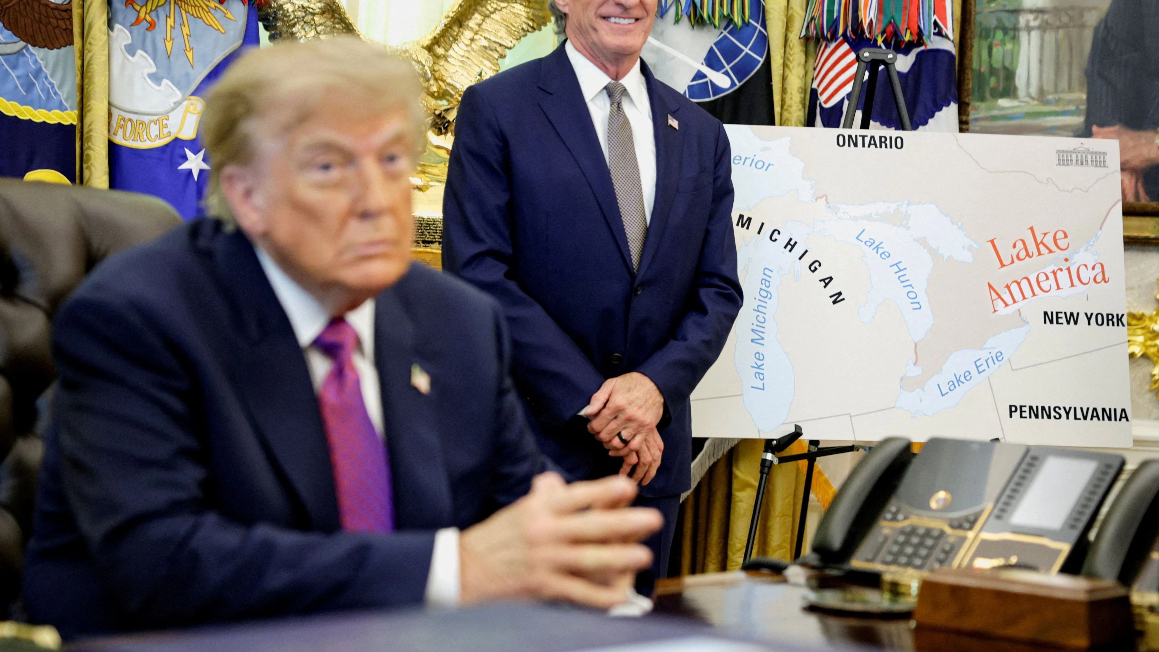 U.S. President Donald Trump sits next to a map with "Lake America" written on it as he attends an event to sign an executive order at the Oval Office of the White House in Washington, D.C., U.S., August 27, 2026. REUTERS/Evan Vucci     TPX IMAGES OF THE DAY     