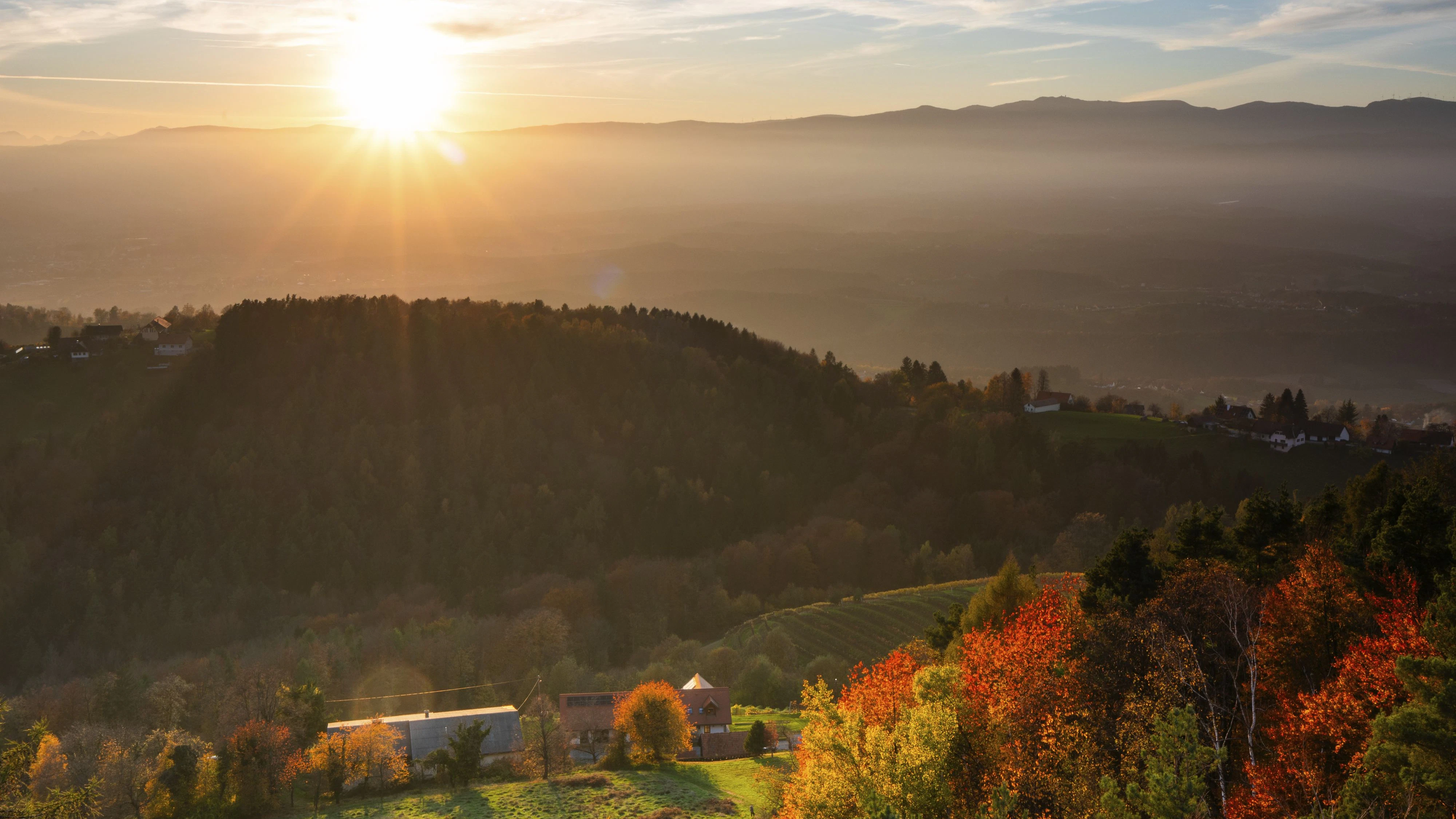 Autumn atmosphere at sunset, forest with foliage colouring, hilly landscape, vineyards, view from the Demmerkogel lookout point, St. Andrä-Höch, Sausal wine country, Styria, Austria