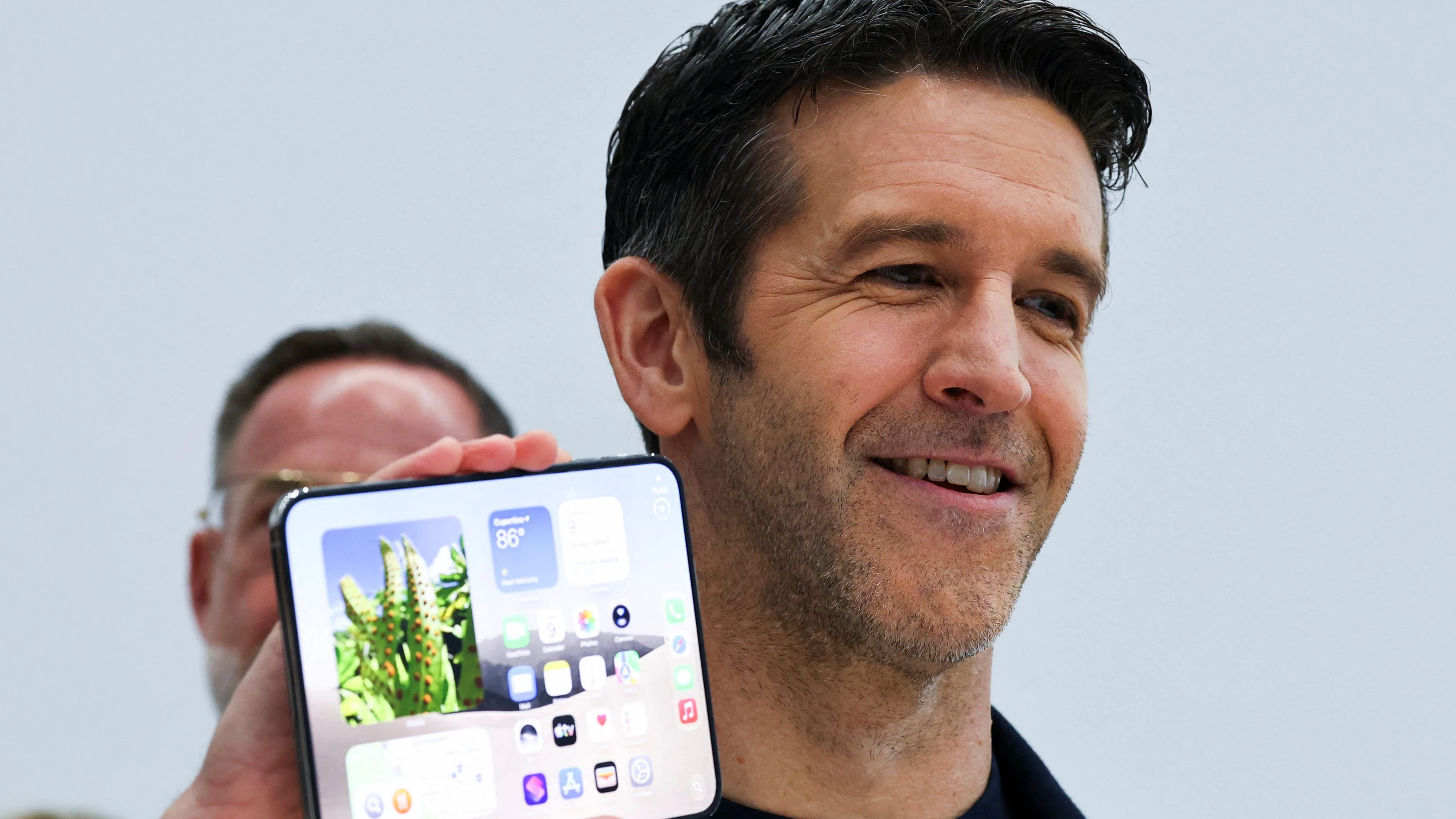 New Apple CEO John Ternus holds the new foldable iPhone Duo during Apple's event at the Steve Jobs Theater in Cupertino, California, U.S. September 9, 2026. REUTERS/Carlos Barria