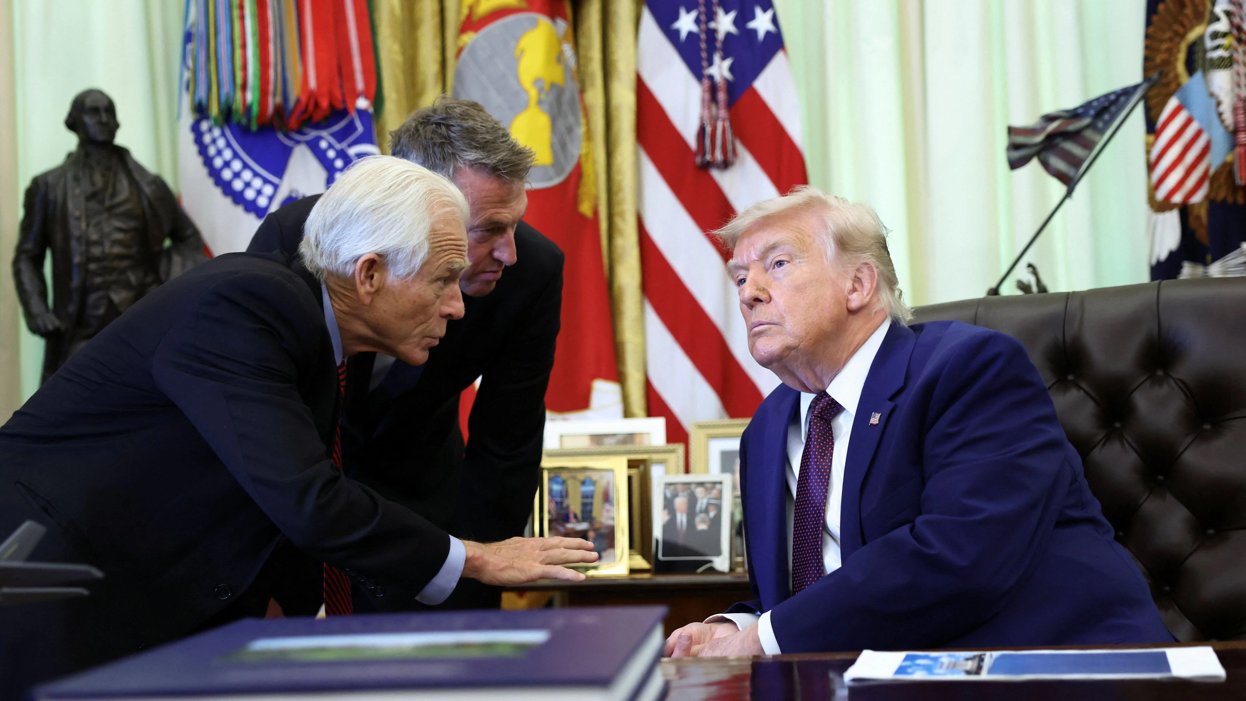U.S. President Donald Trump speaks with Trade and Manufacturing adviser Peter Navarro and Customs and Border Protection Commissioner Rodney Scott in the Oval Office of the White House in Washington, D.C., U.S., June 3, 2026. REUTERS/Kevin Lamarque
