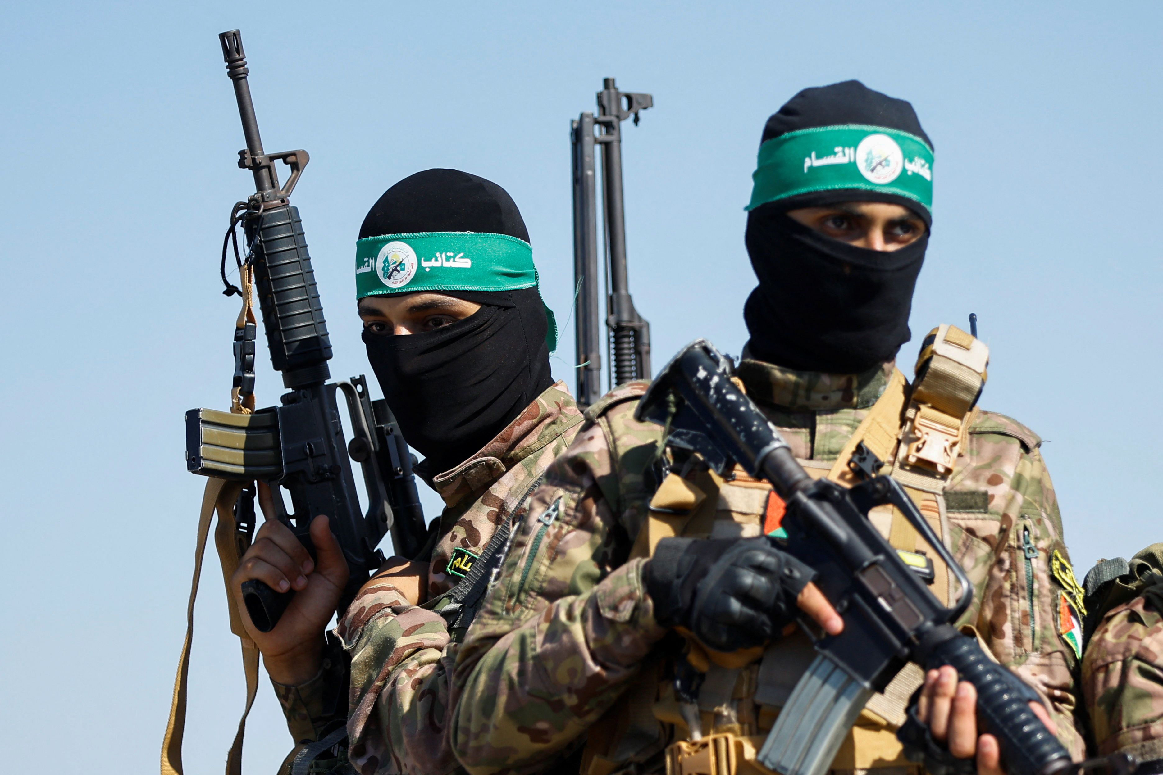 Palestinian fighters from the armed wing of Hamas take part in a military parade to mark the anniversary of the 2014 war with Israel, near the border in the central Gaza Strip, July 19, 2023. REUTERS/Ibraheem Abu Mustafa