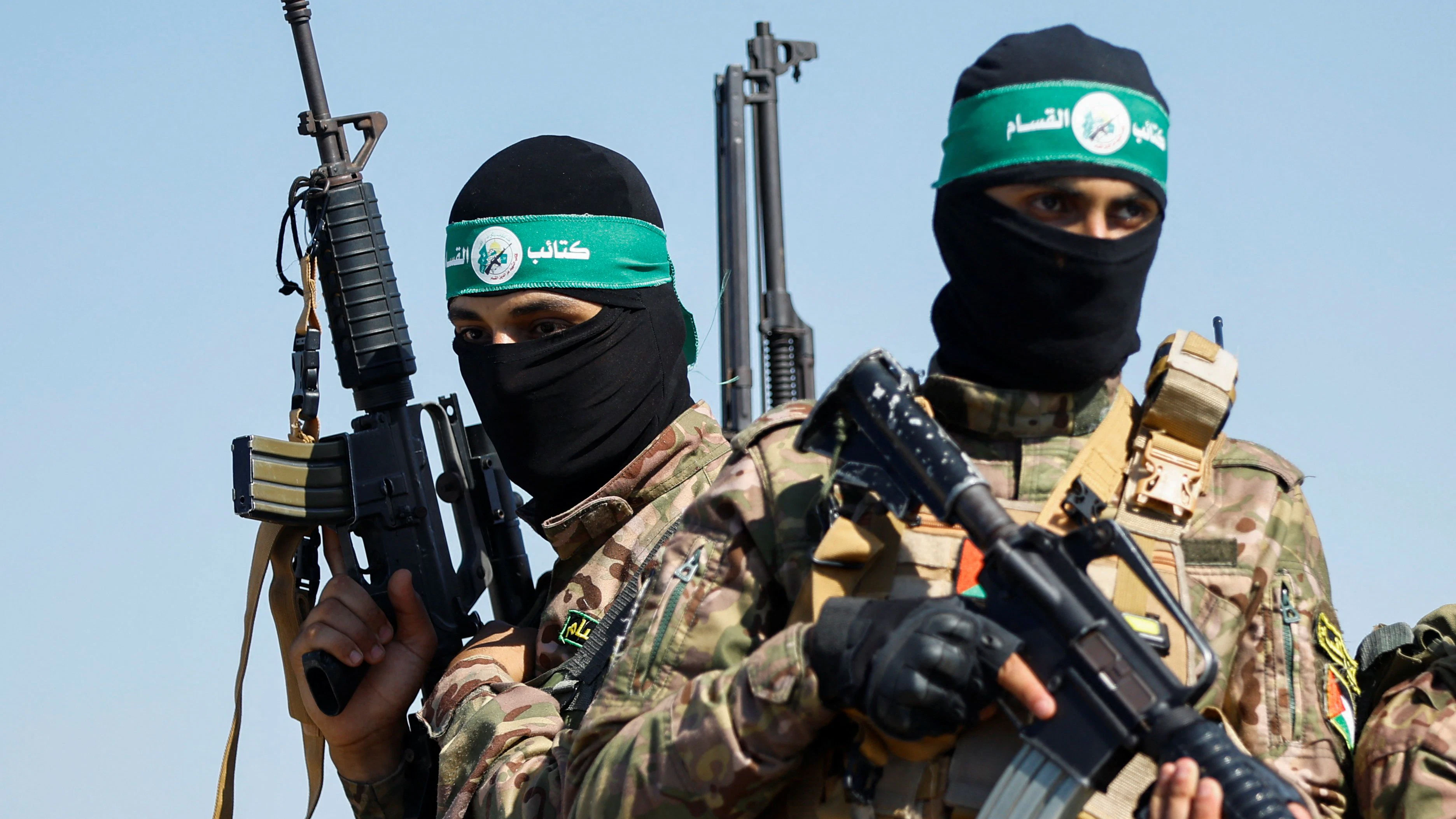 Palestinian fighters from the armed wing of Hamas take part in a military parade to mark the anniversary of the 2014 war with Israel, near the border in the central Gaza Strip, July 19, 2023. REUTERS/Ibraheem Abu Mustafa