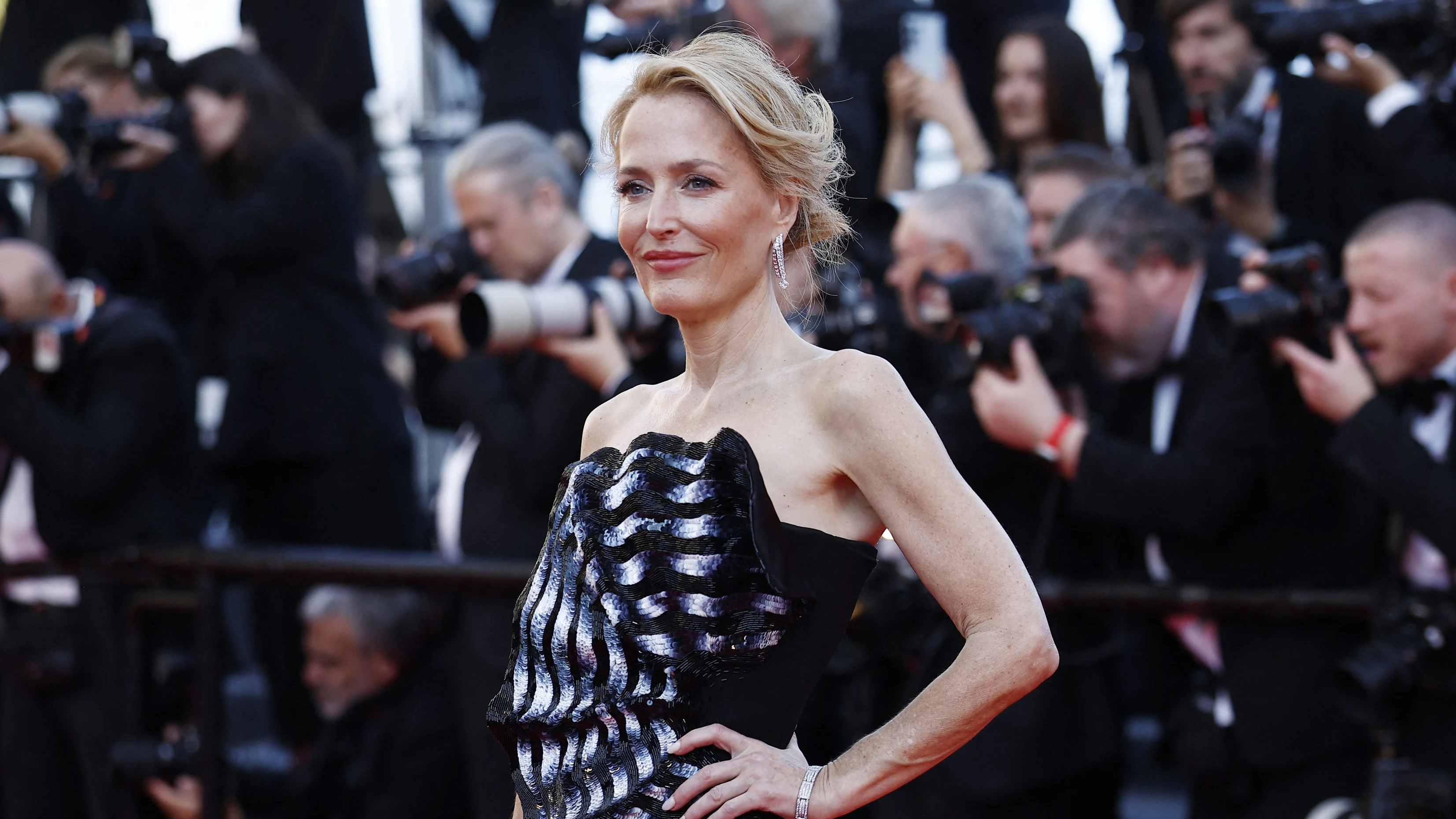 Gillian Anderson poses on the red carpet during arrivals for the screening of the film "Histoires de la nuit" (The Birthday Party) in competition at the 79th Cannes Film Festival in Cannes, France, May 22, 2026. REUTERS/Sarah Meyssonnier