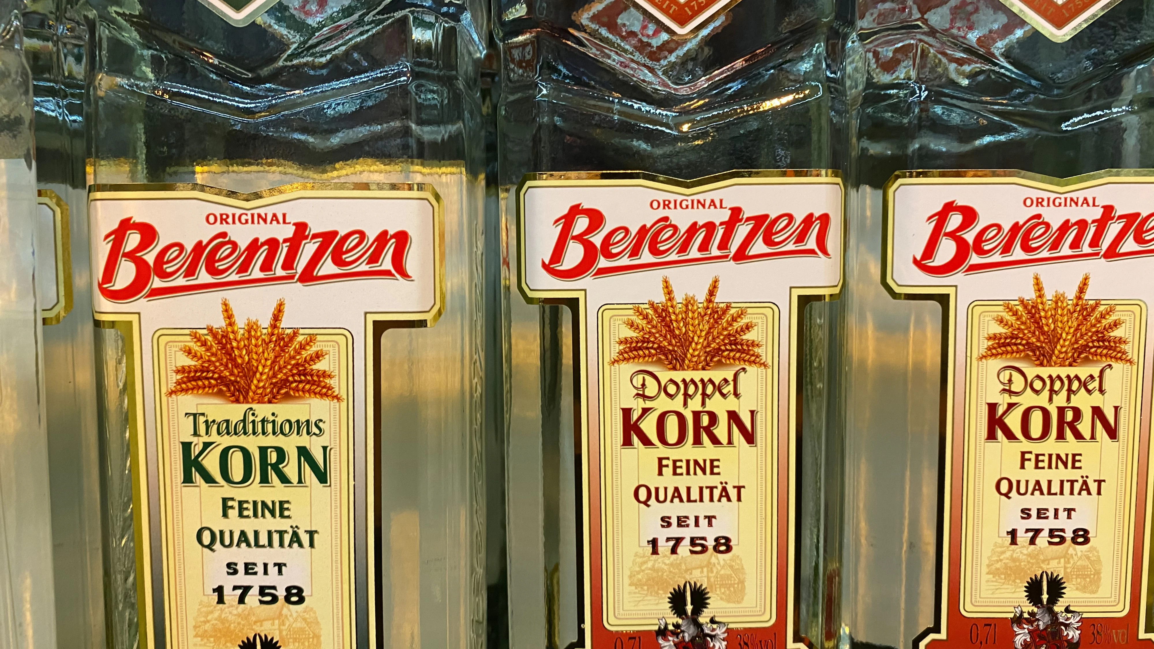 Close up of Berentzen korn bottles in shelf of german supermarket, Viersen, Germany - May 9. 2020: Close up of Berentzen korn bottles in shelf of german supermarket