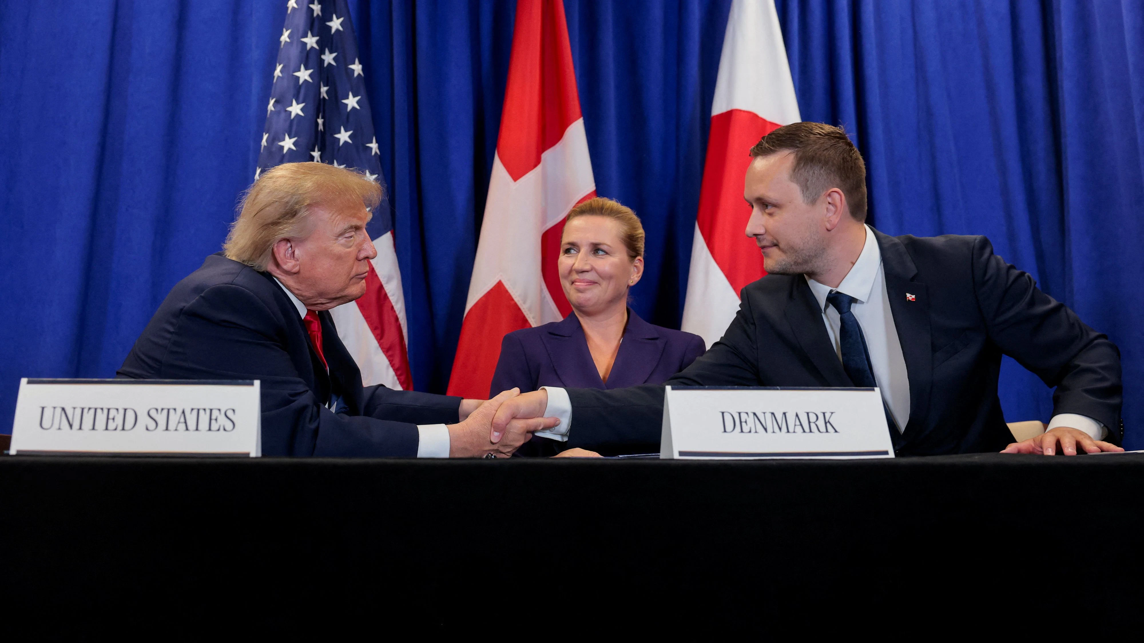 US President Donald Trump shakes hands with Greenland Prime Minister Jens-Frederik Nielsen as Danish Prime Minister Mette Frederiksen reacts, as they attend a trilateral signing event regarding a deal on Greenland's security, during the 81st United Nations General Assembly (UNGA), in New York City, US, September 22, 2026. REUTERS/Kylie Cooper     TPX IMAGES OF THE DAY     