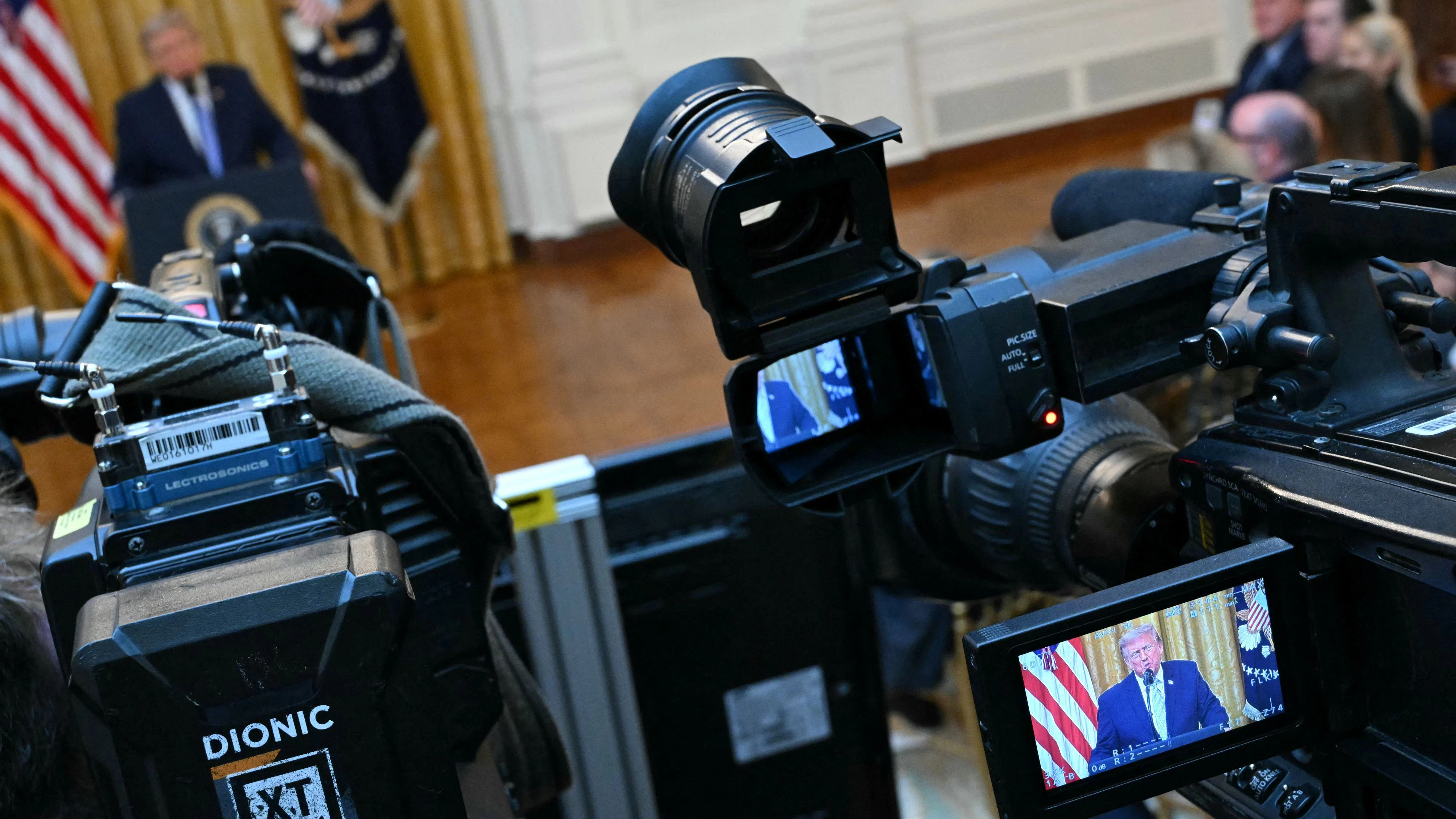 U.S. President Donald Trump is seen on the screen of a camera as he speaks about election security during an address to the nation from the East Room of the White House in Washington, D.C., U.S., July 16, 2026.     SAUL LOEB/Pool via REUTERS