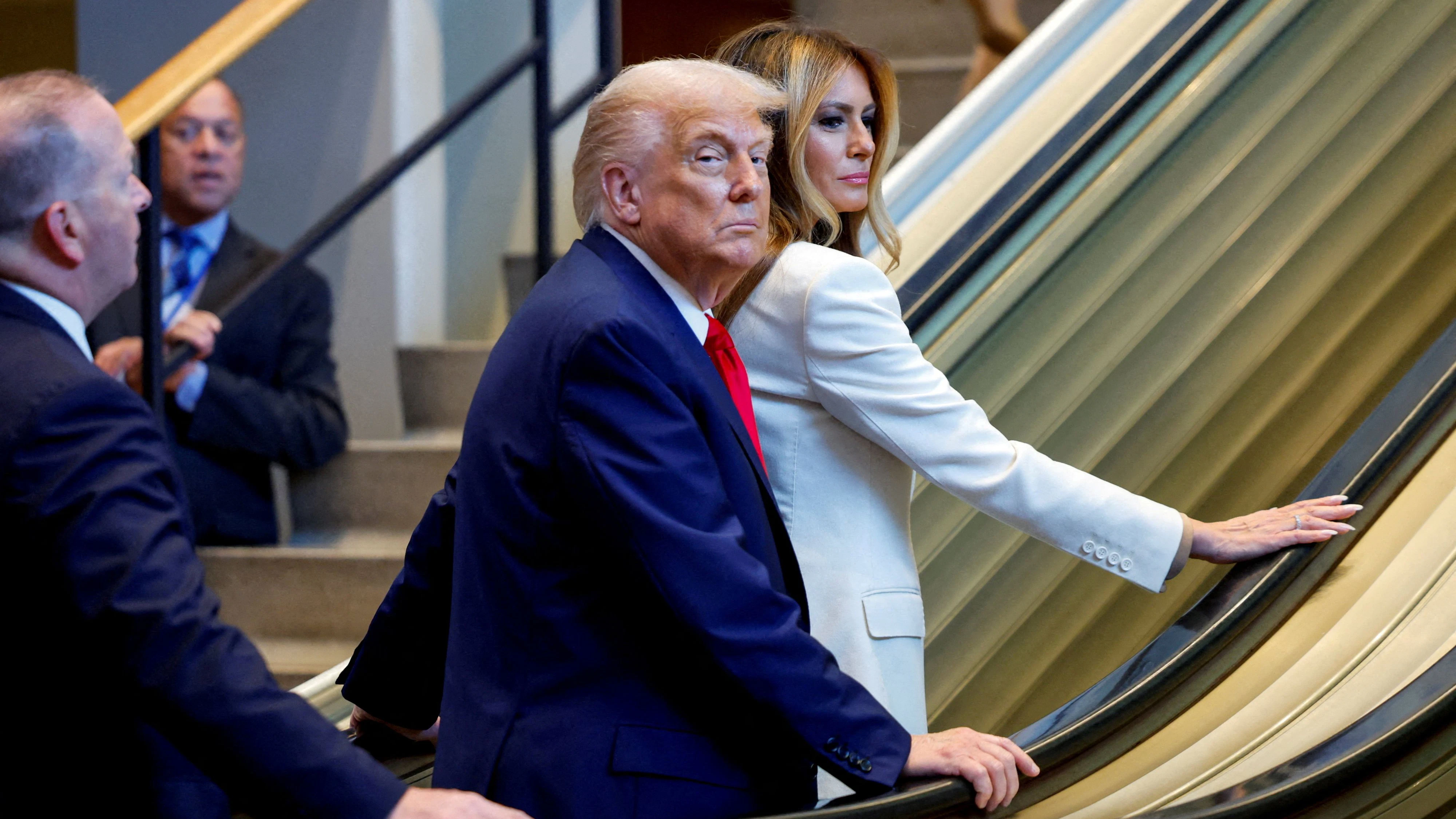 U.S. President Donald Trump and first lady Melania Trump ride an escalator as they arrive to attend the 80th United Nations General Assembly, in New York City, New York, U.S., September 23, 2025. REUTERS/Kylie Cooper  TPX IMAGES OF THE DAY     