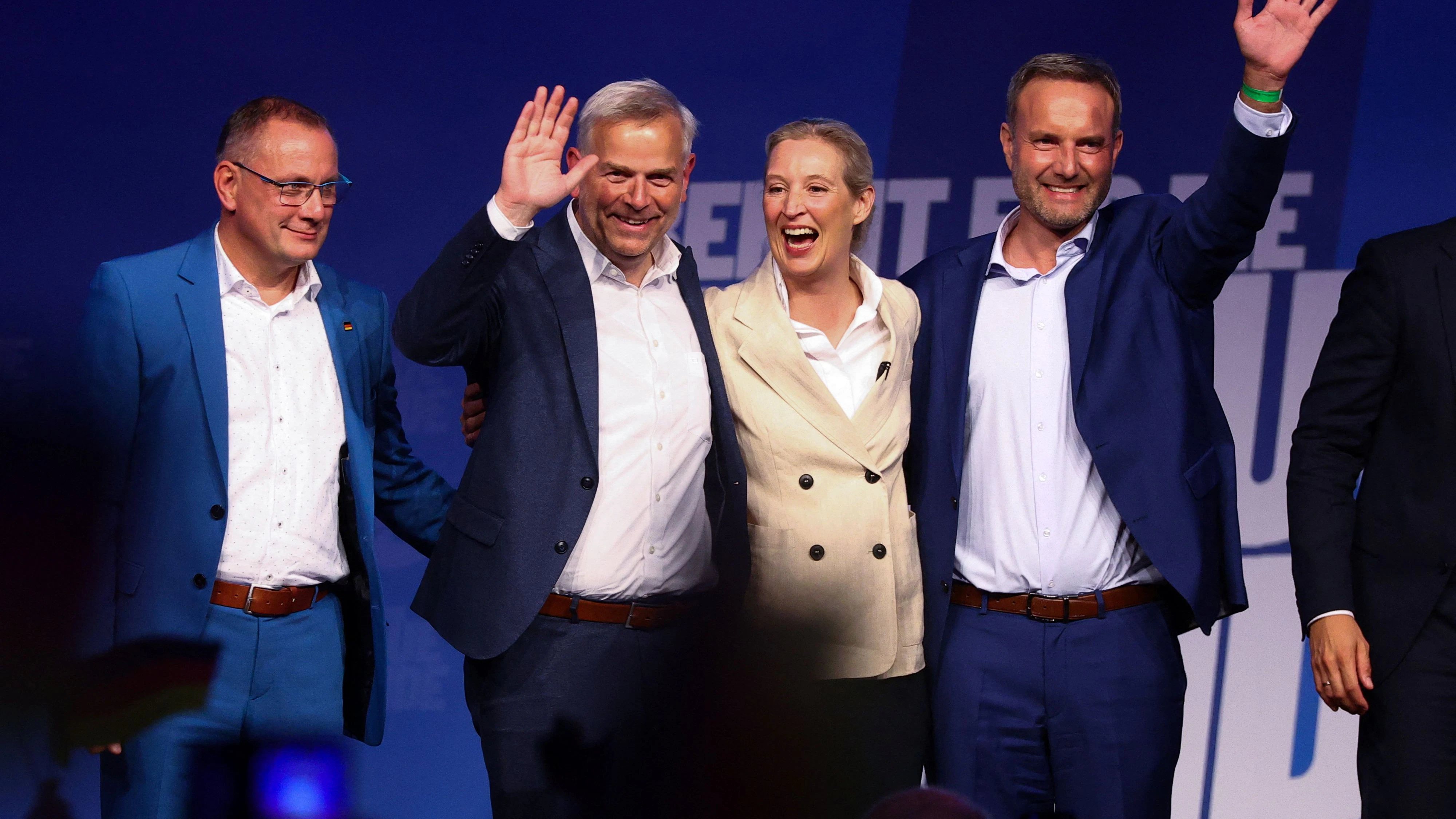 AfD co-leader Alice Weidel, AfD co-leader Tino Chrupalla, AfD candidate for state premier Leif-Erik Holm, and AfD top candidate Ulrich Siegmund react on stage during a campaign event ahead of the Mecklenburg-Western Pomerania state election in Neubrandenburg, Germany, September 18, 2026. REUTERS/Lisi Niesner