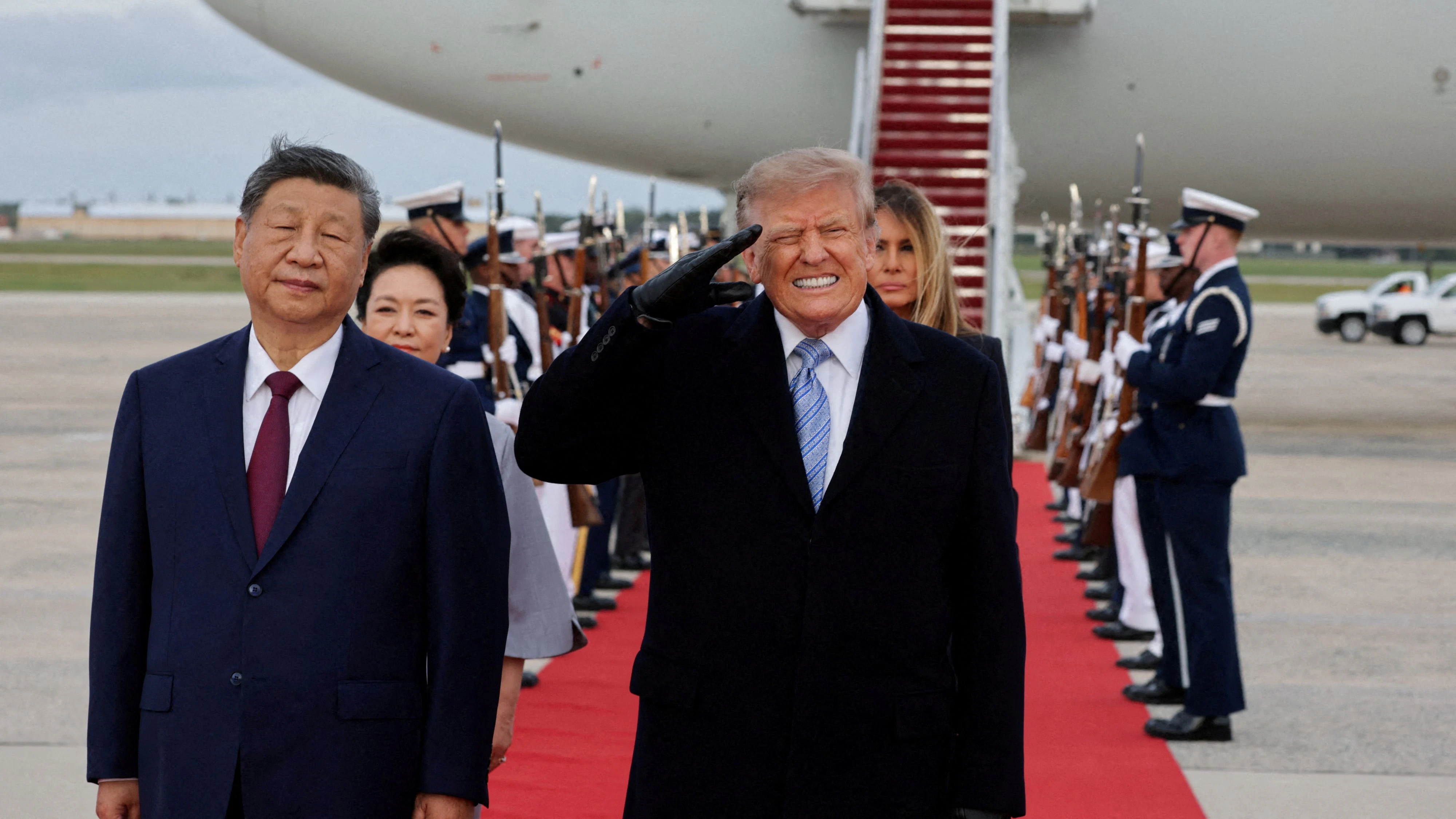 US President Donald Trump reacts to the roar of B-1 bomber flyover during the U.S. national anthem as Trump salutes next to Chinese President Xi Jinping during an arrival ceremony ahead of a state visit at Joint Base Andrews, Maryland, US, September 23, 2026. REUTERS/Jonathan Ernst      TPX IMAGES OF THE DAY     