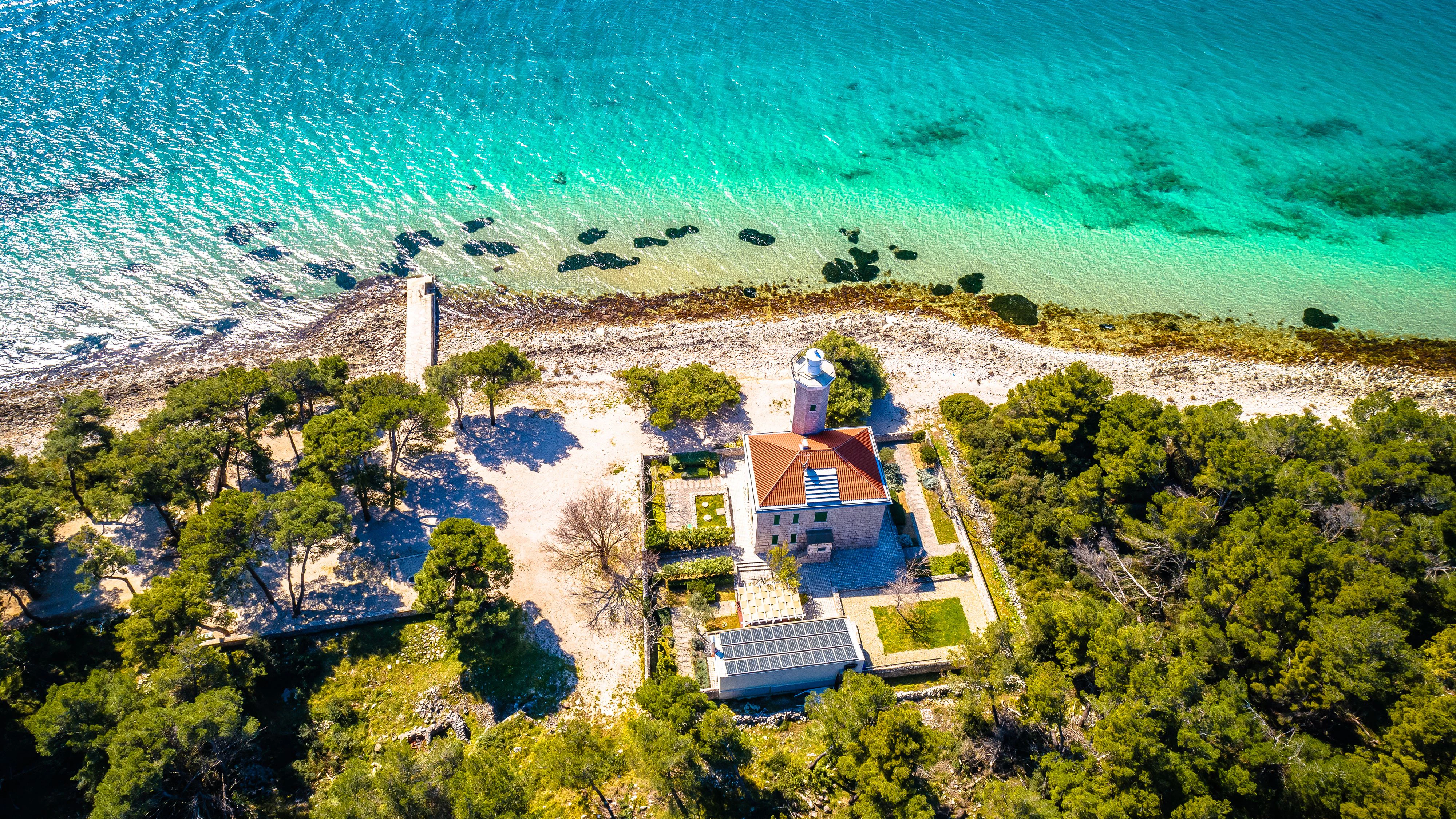 Island of Vir archipelago lighthouse and beach aerial panoramic view, Dalmatia region of Croatia