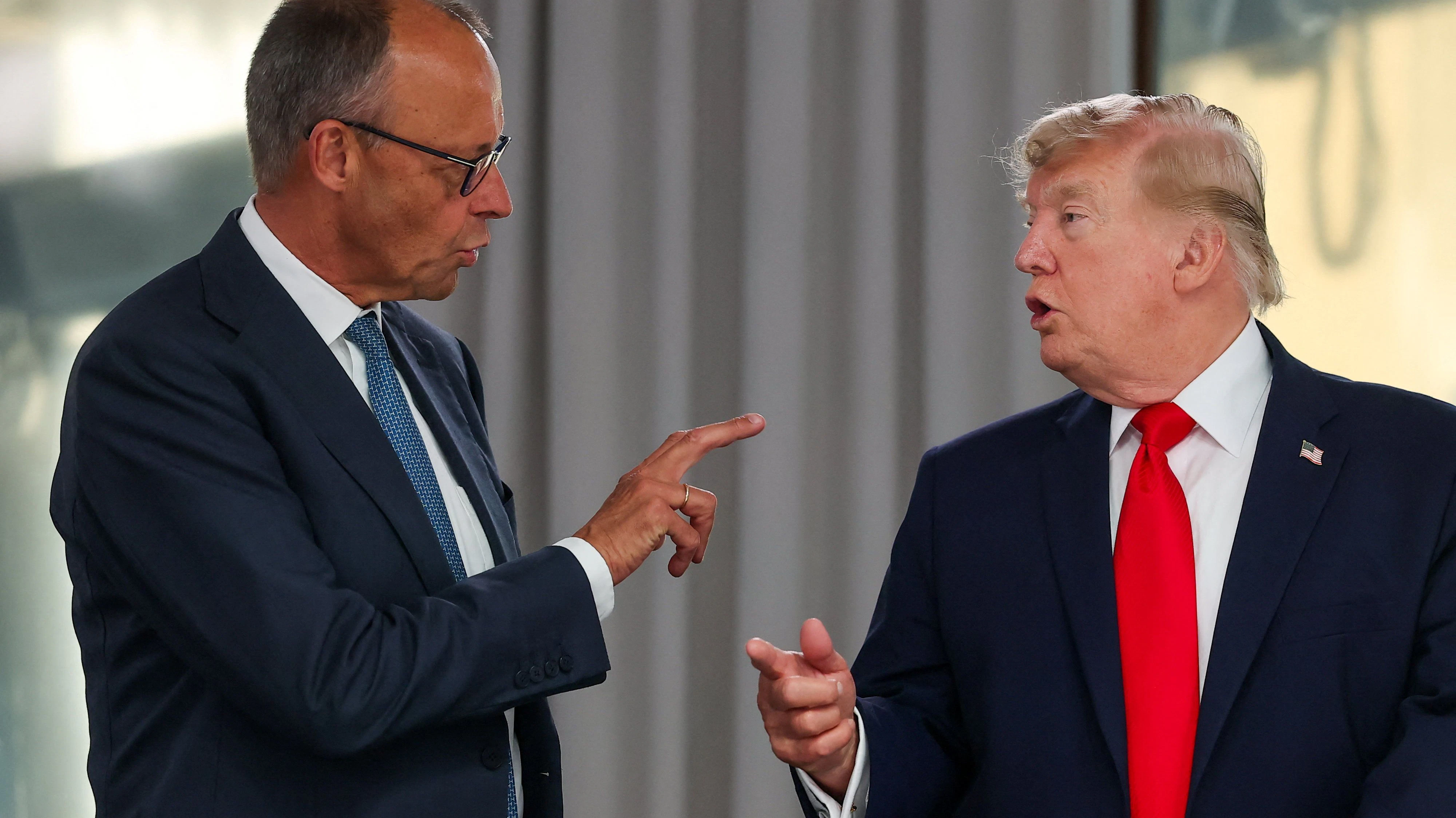U.S. President Donald Trump speaks with Germany's Chancellor Friedrich Merz at a working lunch with leaders of G7 and the Middle East during the G7 summit, in Evian-les-Bains, France, June 16, 2026. REUTERS/Christian Hartmann/Pool 