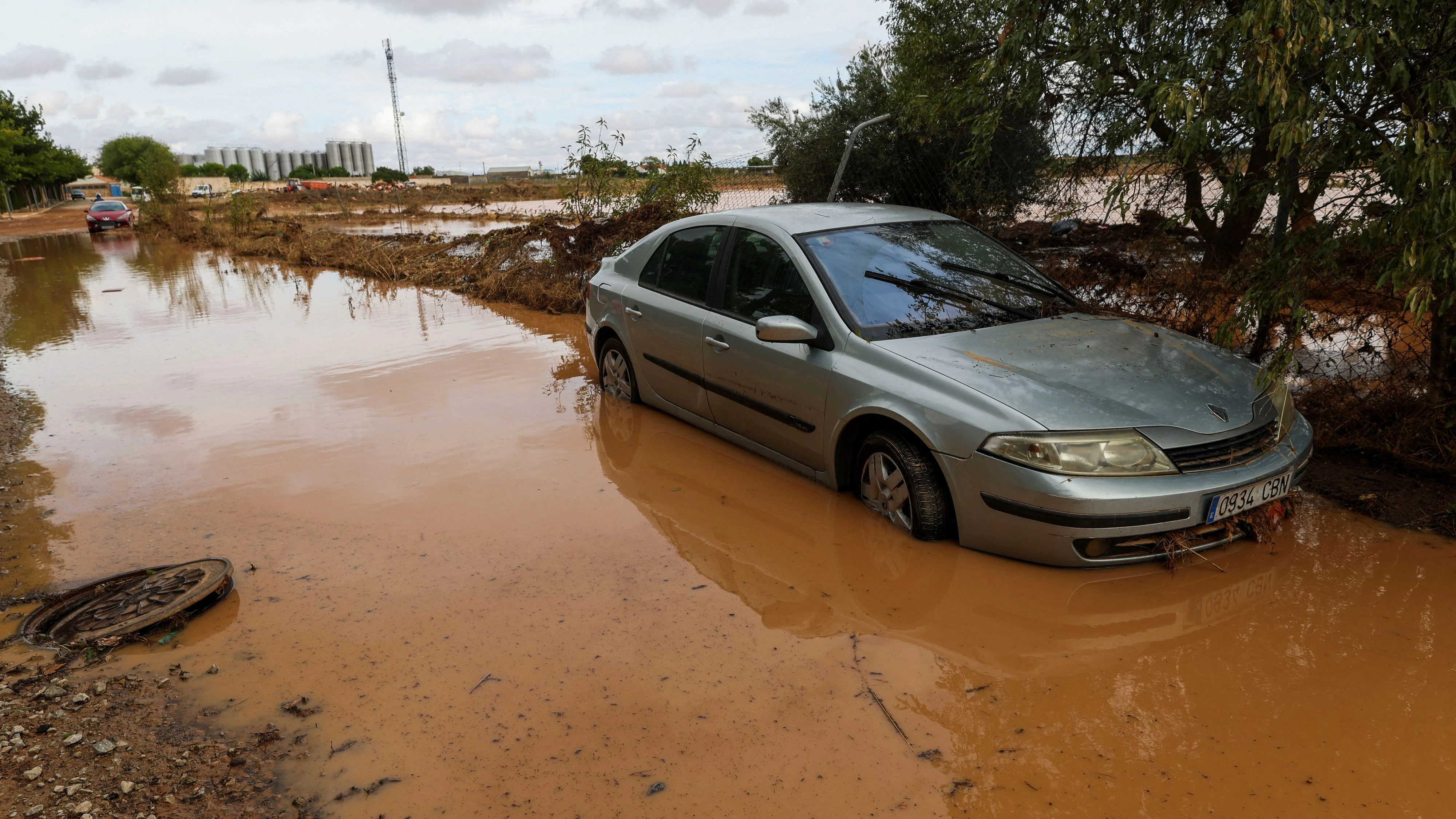 Partially submerged vehicle in the aftermath of flooding caused by heavy rains, in Madrigueras, Spain, October 3, 2026. REUTERS/Eva Manez