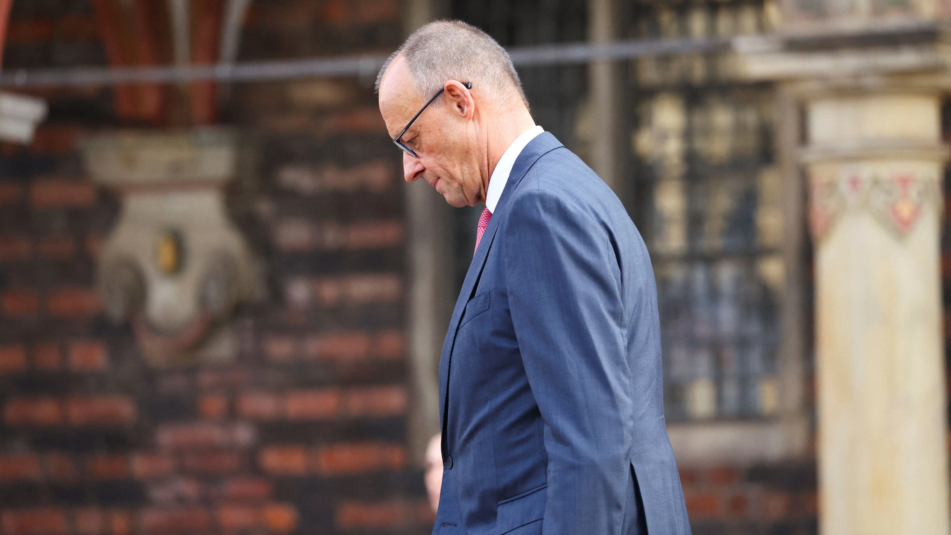 German Chancellor Friedrich Merz stands in front of Bremen town hall on the day of celebrations to mark the 36th anniversary of Germany's Unification Day, in Bremen, Germany, October 3, 2026. REUTERS/Thilo Schmuelgen