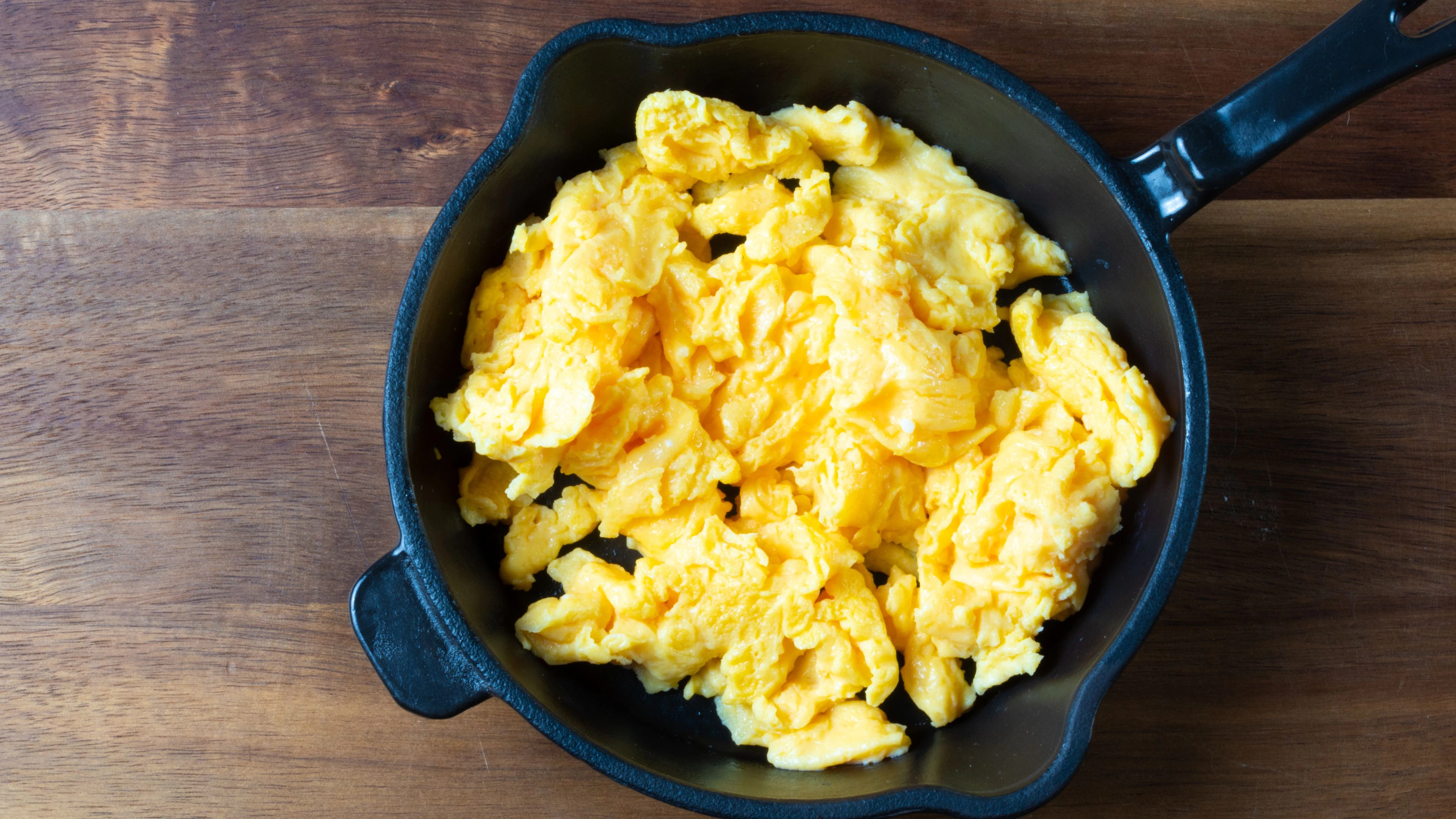 Scrambled eggs in a frying pan