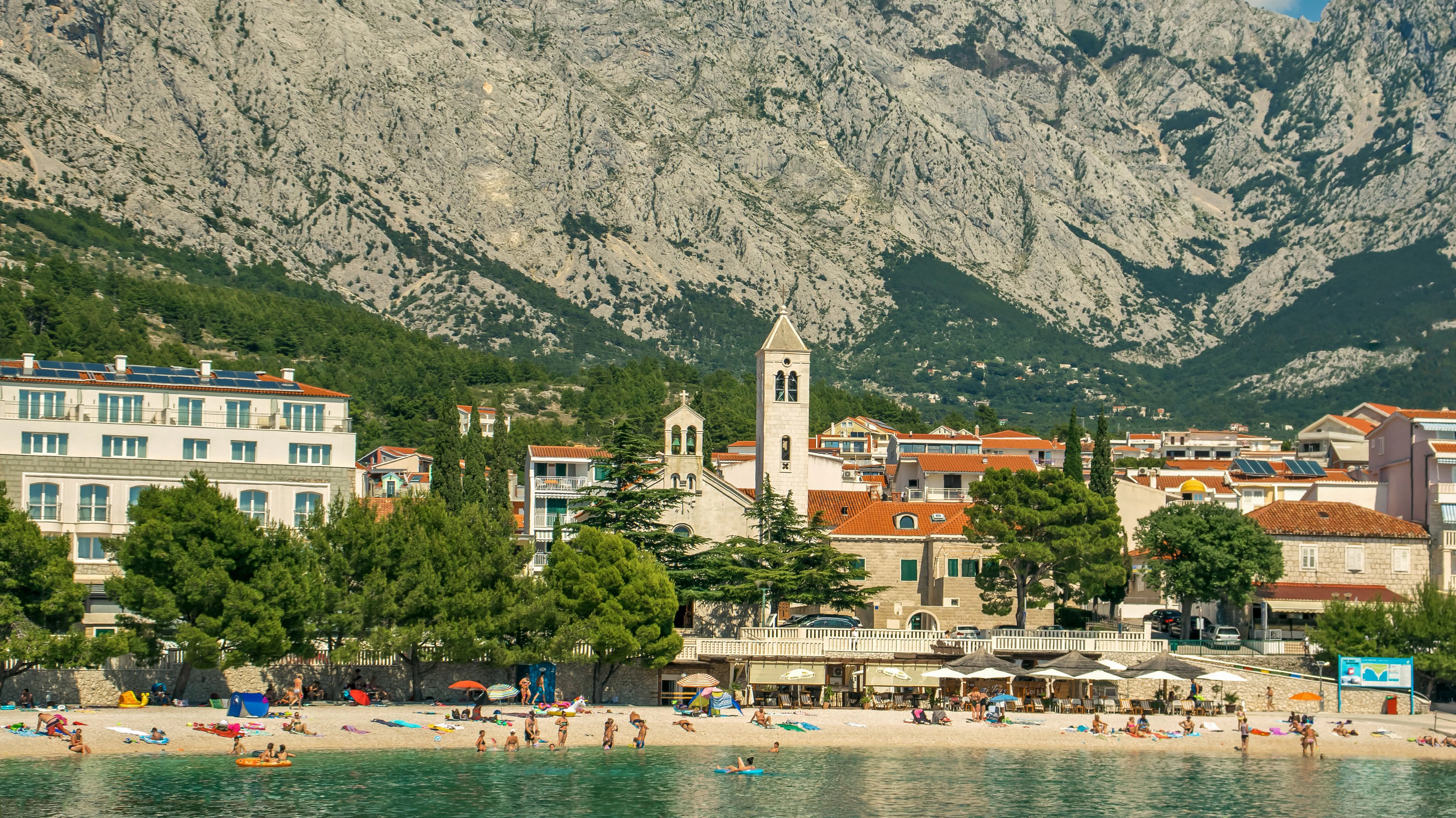 Architecture and high mountains of the Croatian city of Baska Water from water