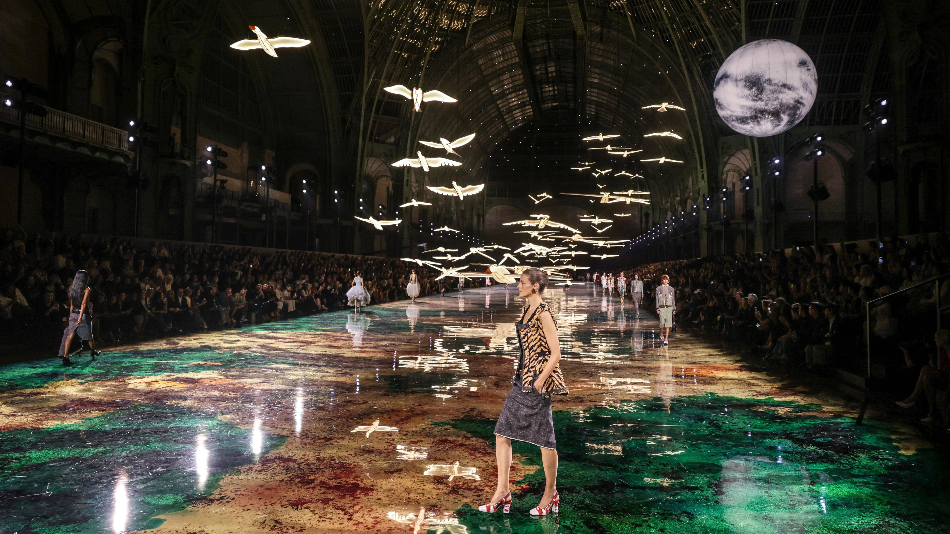 Models wear creations as part of the Chanel Womenswear Spring Summer 2027 collection presented in Paris, France, Monday, Oct. 5, 2026. (AP Photo/Thomas Padilla)