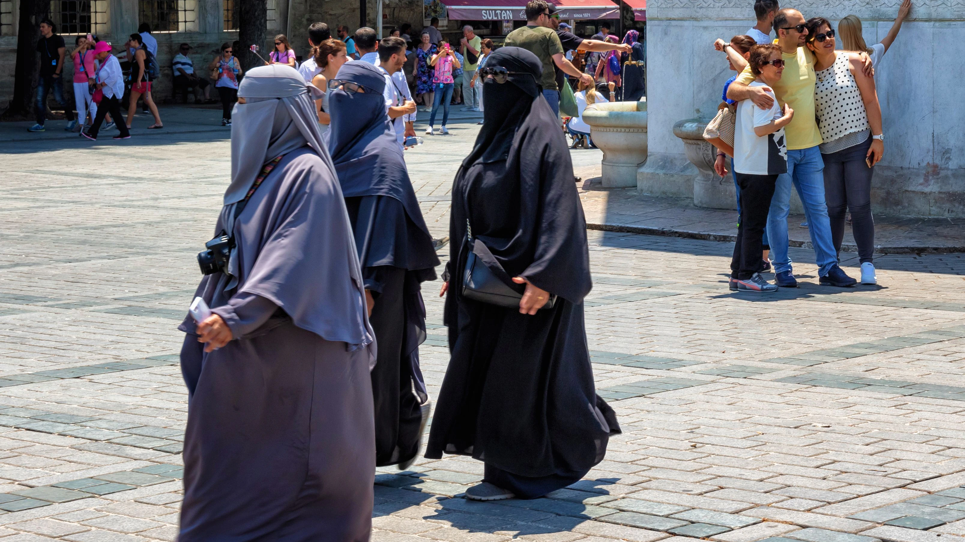 Istanbul, Turkey - July 05, 2018: Unknown women in hijab clothes on one of the central streets of Istanbul.