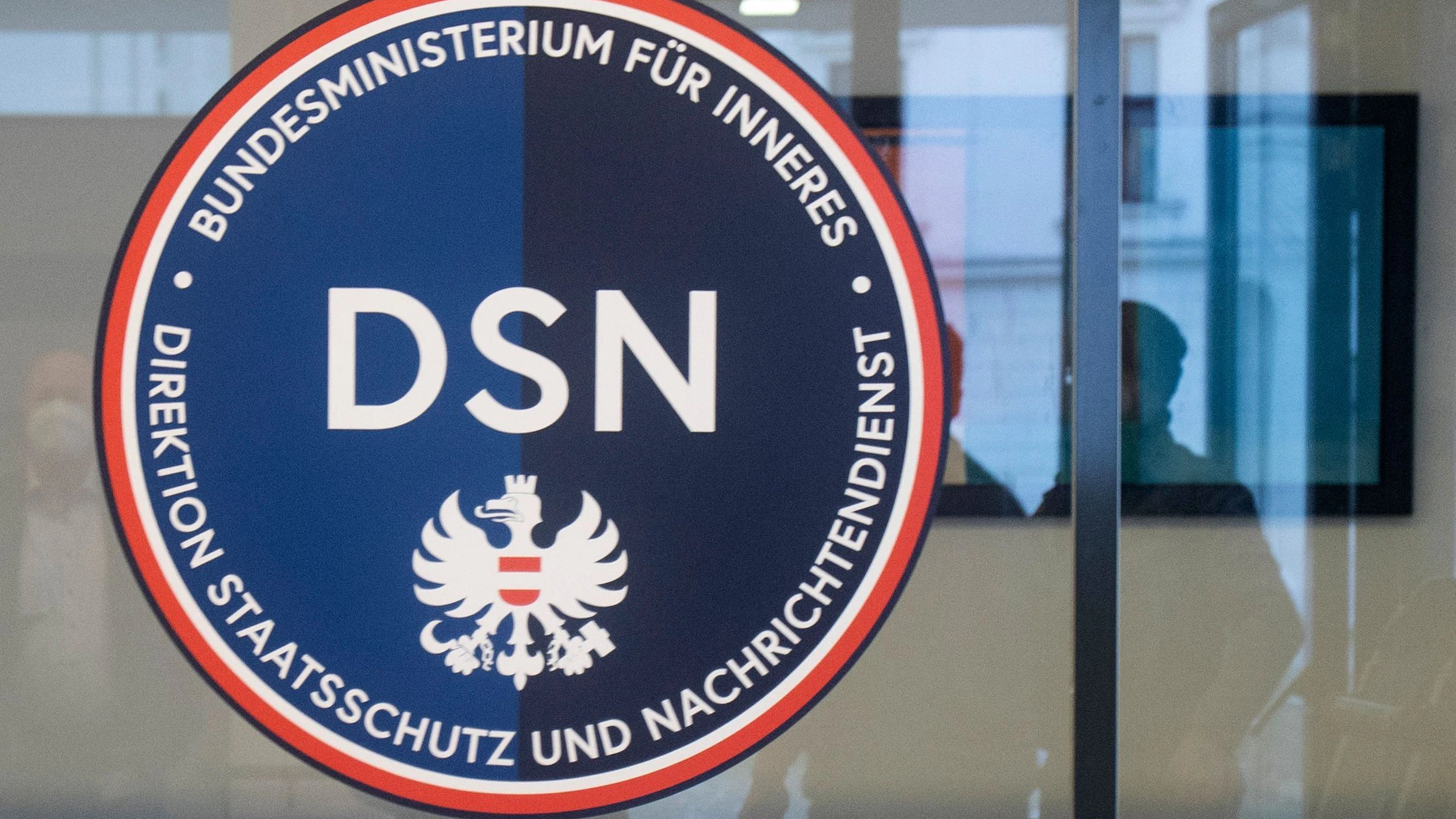 The logo of Austria's new Directorate for State Security and Intelligence Service (DSN), is pictured in Vienna on January 25, 2022. - Some radicalised activists who reject Covid vaccines and anti-virus measures are crossing borders to join protests where extremist ideology is being spread, Austria's new domestic intelligence chief told AFP, calling the trend "very scary". (Photo by ALEX HALADA / AFP)