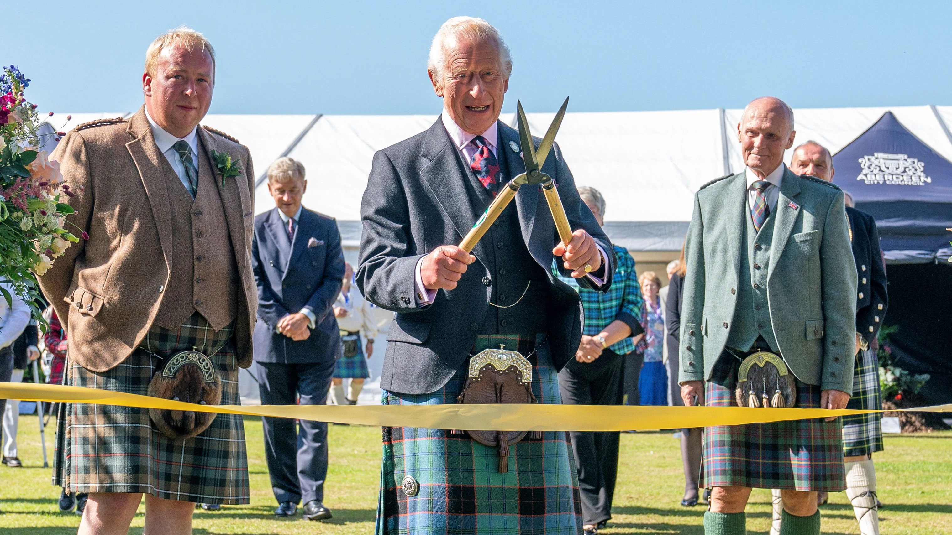 Britain's King Charles uses a pair of gardening shears to officially open the Royal Horticultural Society of Aberdeen's 200th Flower Show at Duthie Park, Aberdeen, Scotland, Britain, August 31, 2024. Jane Barlow/Pool via REUTERS