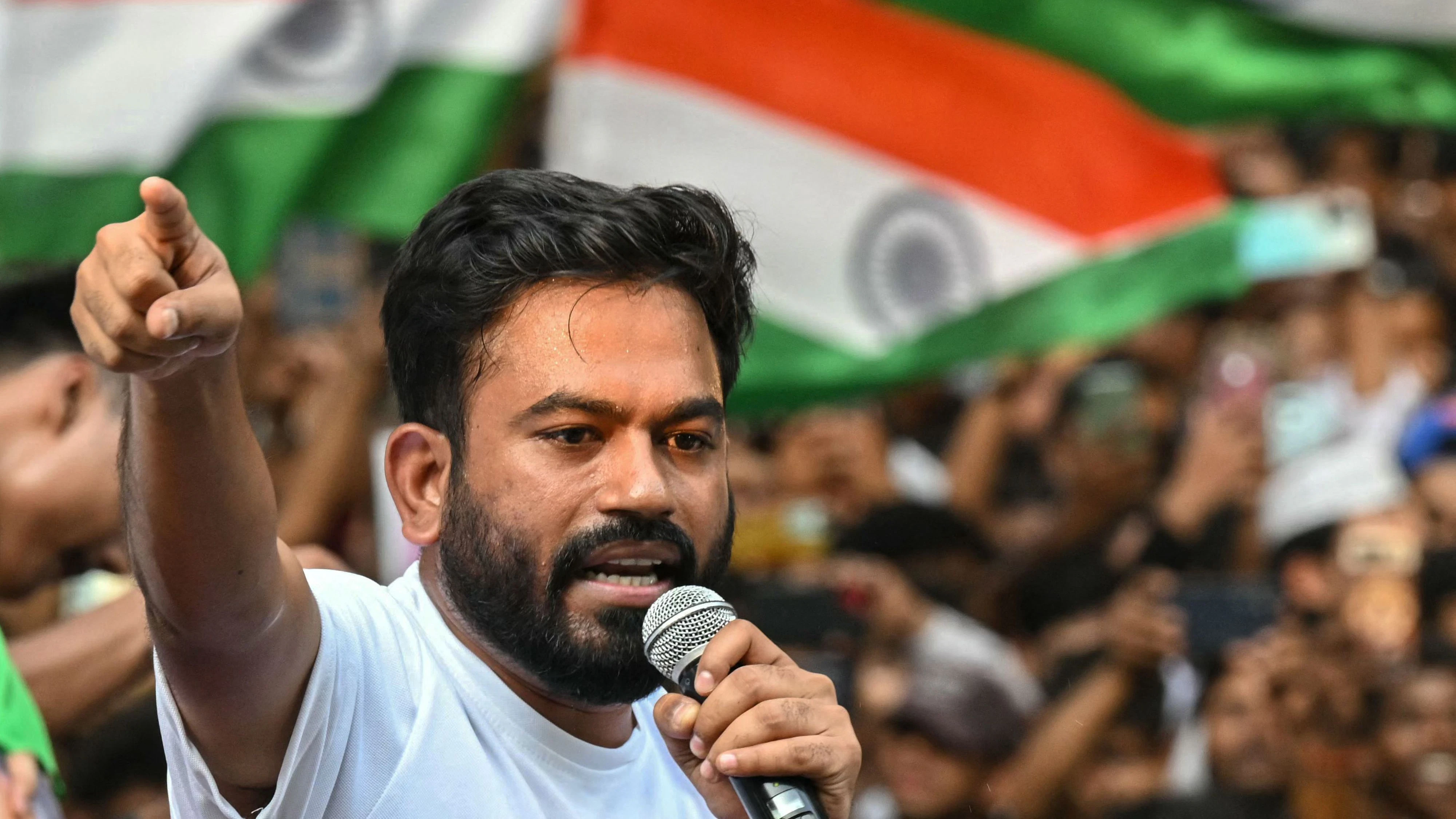 Cockroach Janta Party (CJP) founder Abhijeet Dipke addresses supporters during a protest demanding the resignation of India's chief election commissioner Gyanesh Kumar over alleged voter-roll irregularities in Mumbai on October 2, 2026. Indian protesters rallied in New Delhi and Mumbai on October 2, including members of the popular youth-led "cockroach" party, demanding the resignation of the chief election commissioner over alleged voter-roll irregularities. (Photo by Indranil MUKHERJEE / AFP)