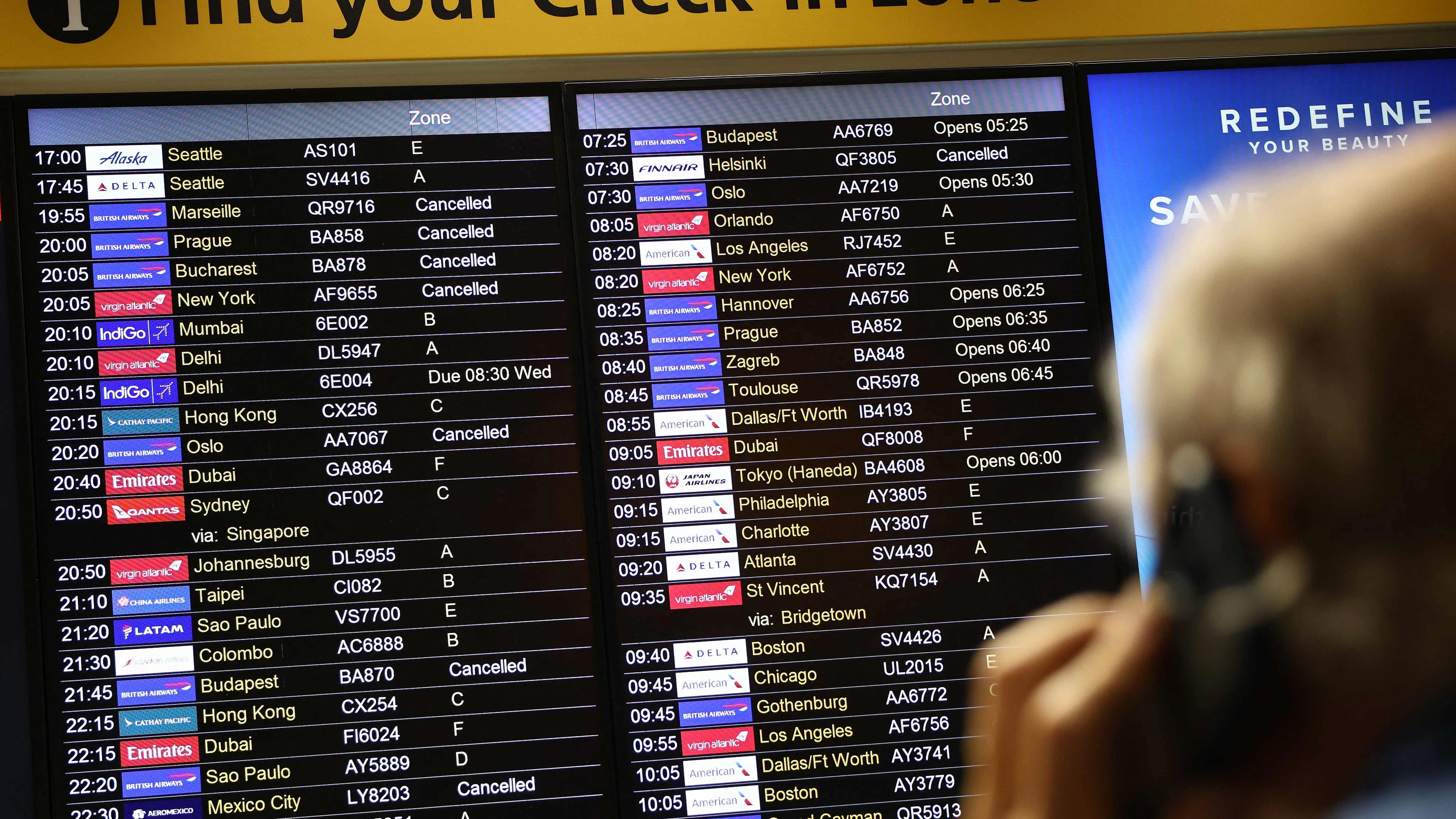 TOPSHOT - Cancelled flights are pictured on an electronic check-in display board at Terminal 3 of London Heathrow airport, west of London on September 8, 2026, following major disruption due an issue affecting the NATS air traffic control systems. Flights to and from the UK were cancelled on on September 8, due to a "technical issue" affecting UK's National Air Traffic Services (NATS), which says it is working to resolve the situation. (Photo by Henry NICHOLLS / AFP)