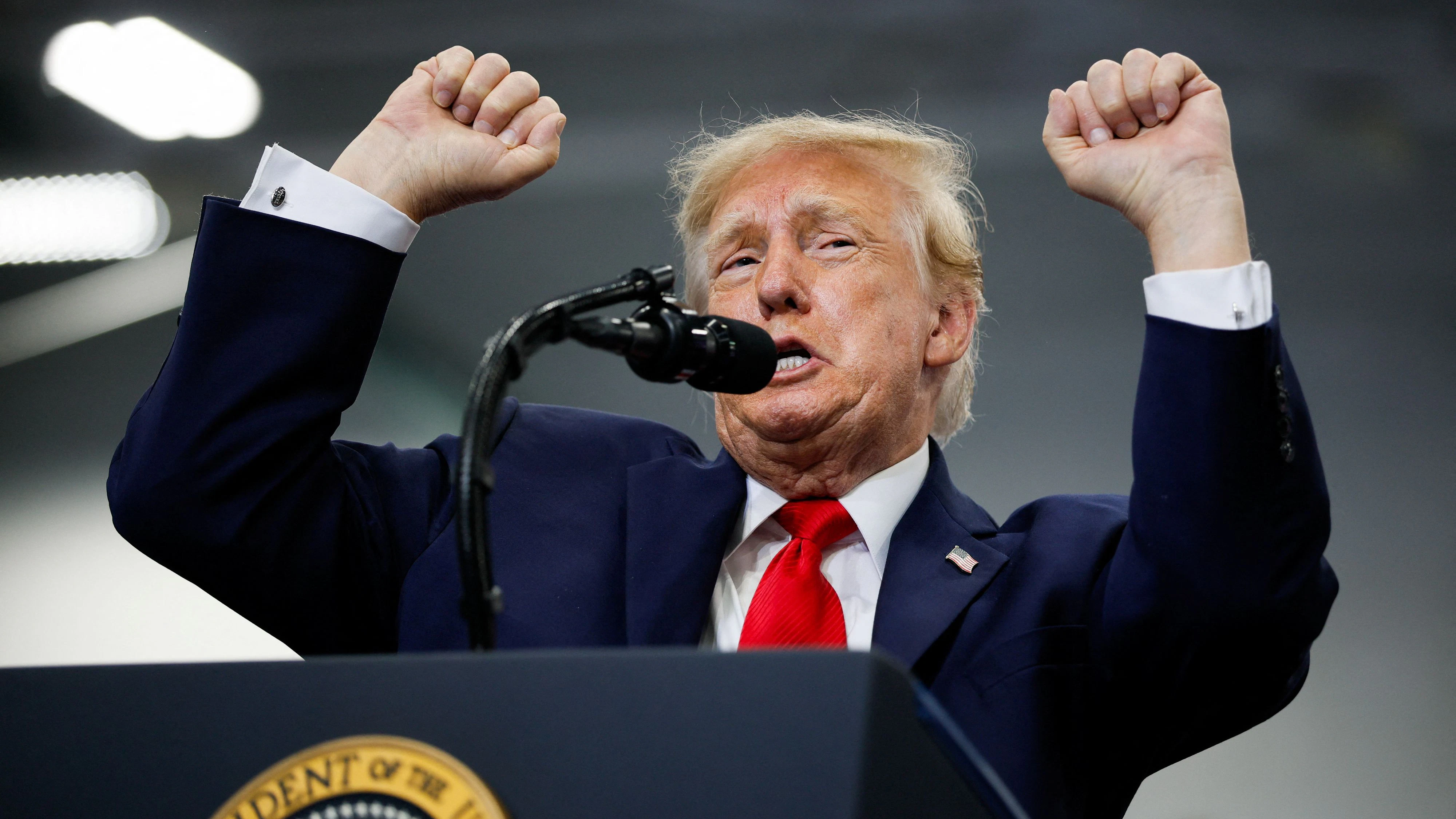 US President Donald Trump gestures on stage as he speaks at the Curtis D. Menard Memorial Sports Center in Wasilla, Alaska, US, October 13, 2026. REUTERS/Evan Vucci
