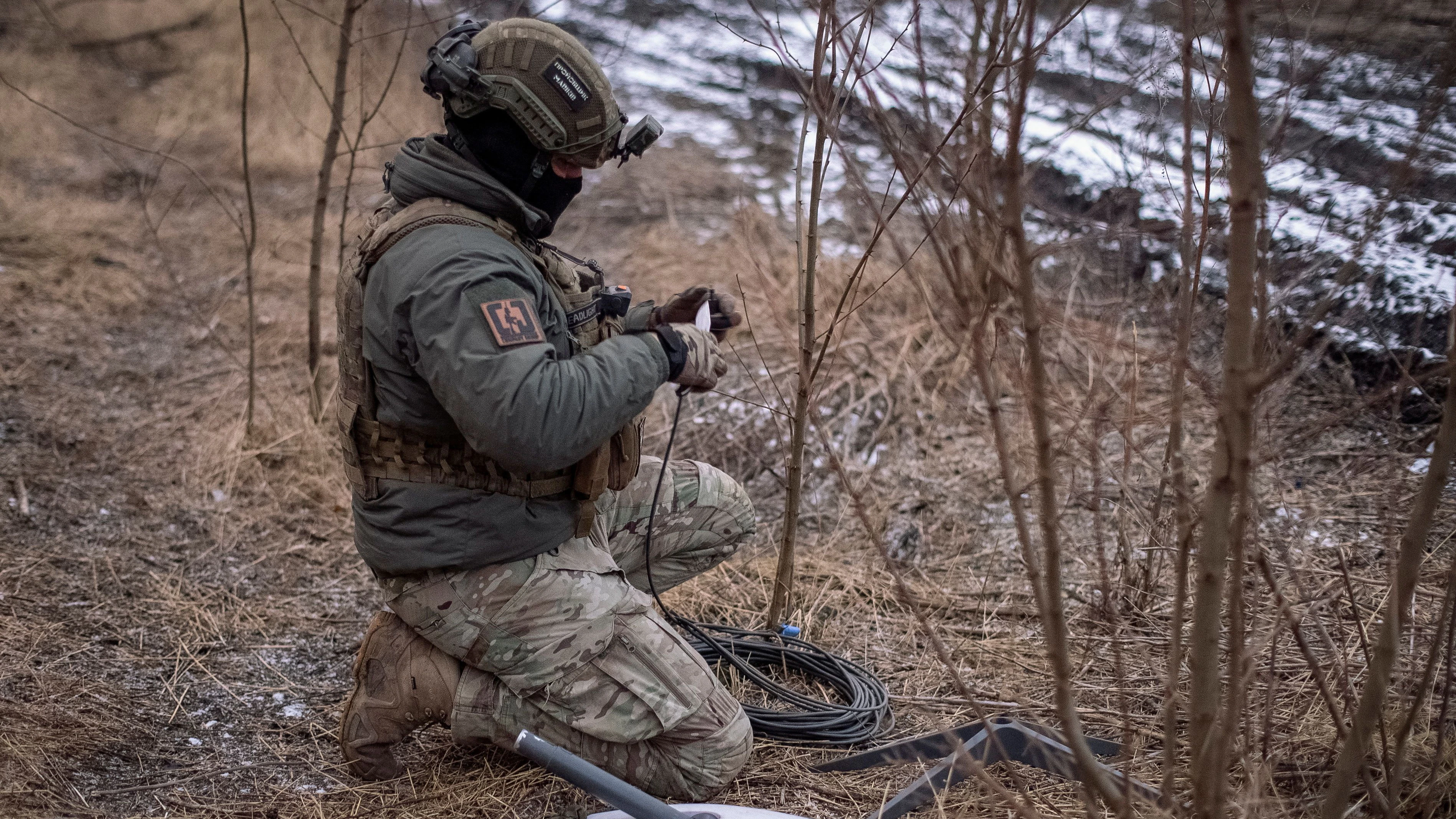 FILE PHOTO: A Ukrainian serviceman of 47th brigade prepares a Starlink satellite internet systems at his positions at a front line, amid Russia's attack on Ukraine, near the town of Avdiivka, recently captured by Russian troops in Donetsk region, Ukraine February 20, 2024. REUTERS/Inna Varenytsia/File Photo