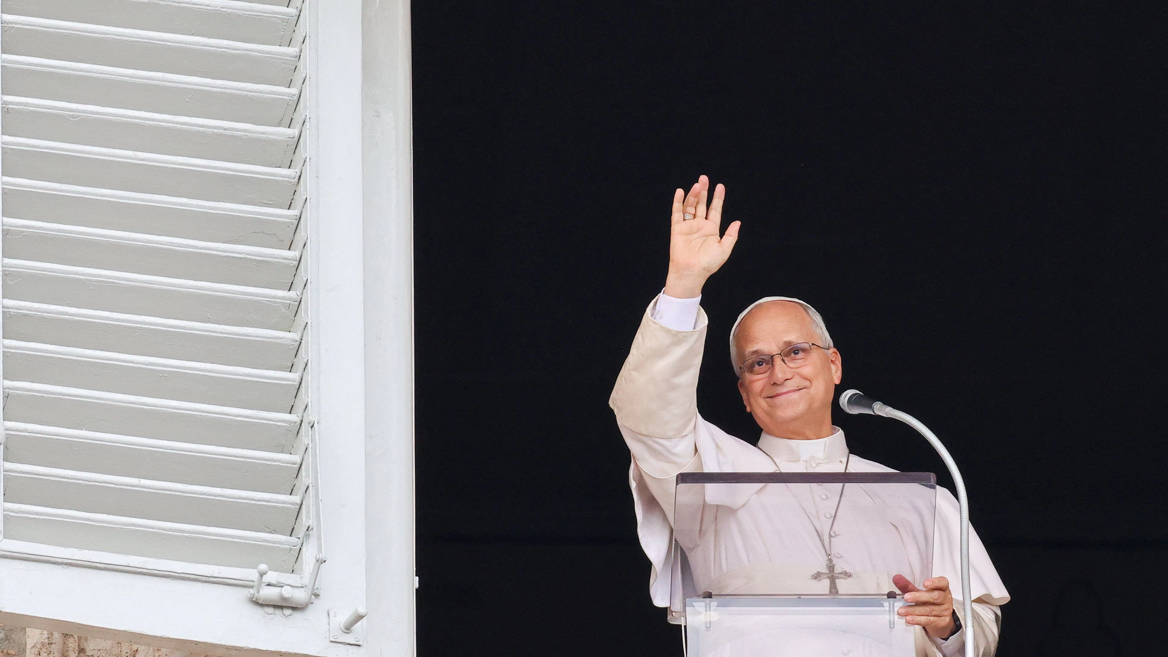 Pope Leo waves, as he leads the Angelus prayer from a window of the Apostolic Palace, following his discharge from hospital after surgery for lung cancer, at the Vatican, October 18, 2026. REUTERS/Yara Nardi