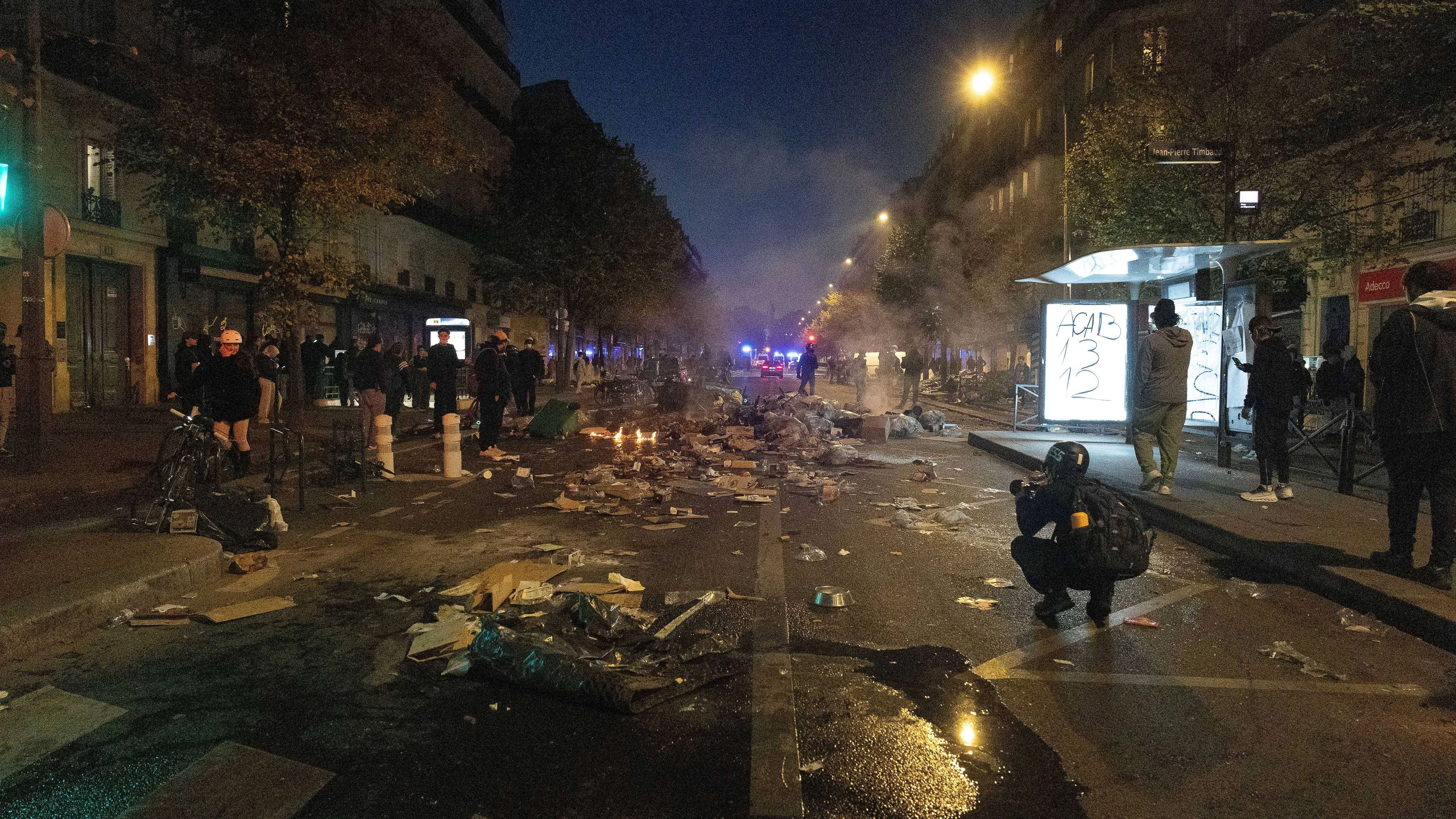 October 18, 2026, Paris, France: PARIS, FRANCE - OCTOBER 18, 2026: Protesters clash with police near Place de la RÃ publique in Paris during a protest against austerity. Protesters set up makeshift barricades and start fires in the square and surrounding streets. After police clear the square, protesters attack nearby shops. Paris France - ZUMAq101 20261018_zna_q101_290 Copyright: xOualidxAbdellaouix