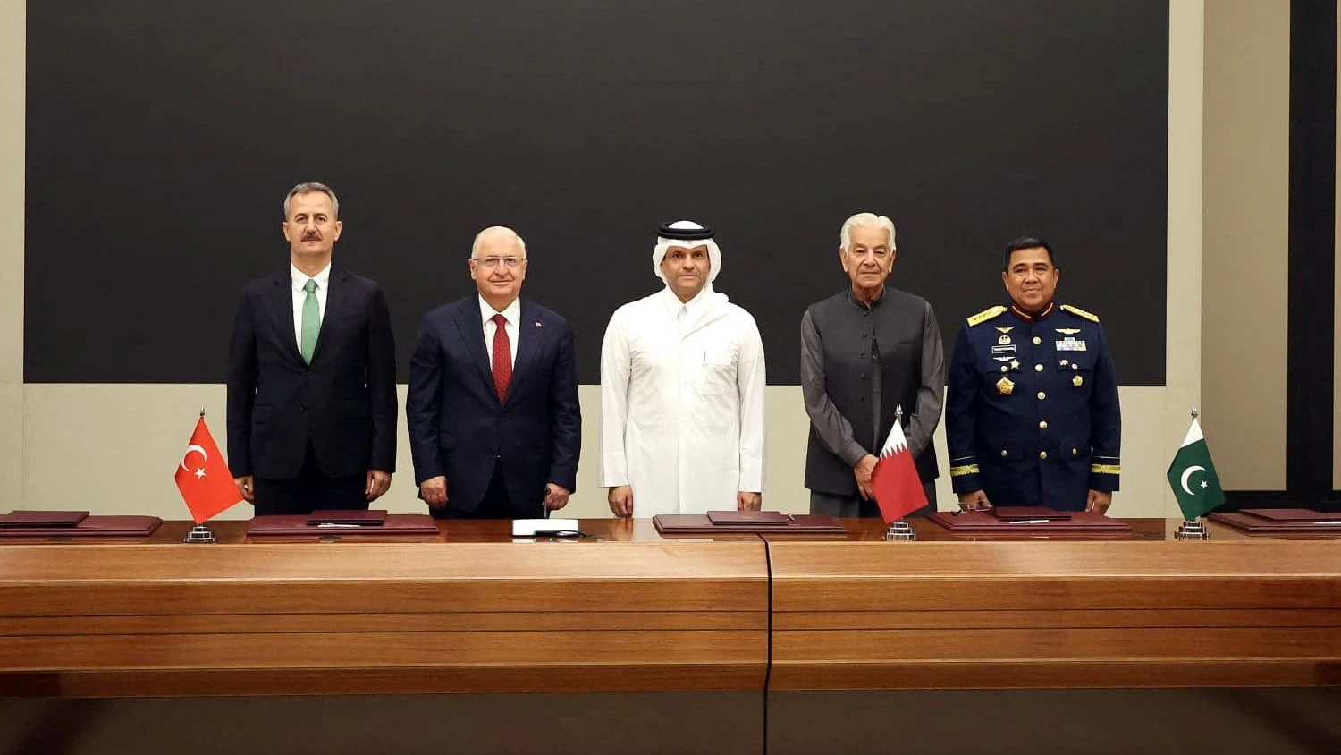 Turkey's Defence Minister Yasar Guler, Secretary of Turkish Defence Industries Haluk Gorgun, Qatar's Deputy Prime Minister and Minister of Defence Sheikh Saud bin Abdulrahman bin Hassan bin Ali Al-Thani, Pakistan's Defence Minister Khawaja Muhammad Asif and Indonesia's Deputy Defense Minister for Logistics, Defense Industry, and Technology Yusuf Jauhari attend a signing ceremony in Doha, Qatar, October 21, 2026. Turkish Defence Ministry/Handout via REUTERS ATTENTION EDITORS - THIS PICTURE WAS PROVIDED BY A THIRD PARTY. NO RESALES. NO ARCHIVES.