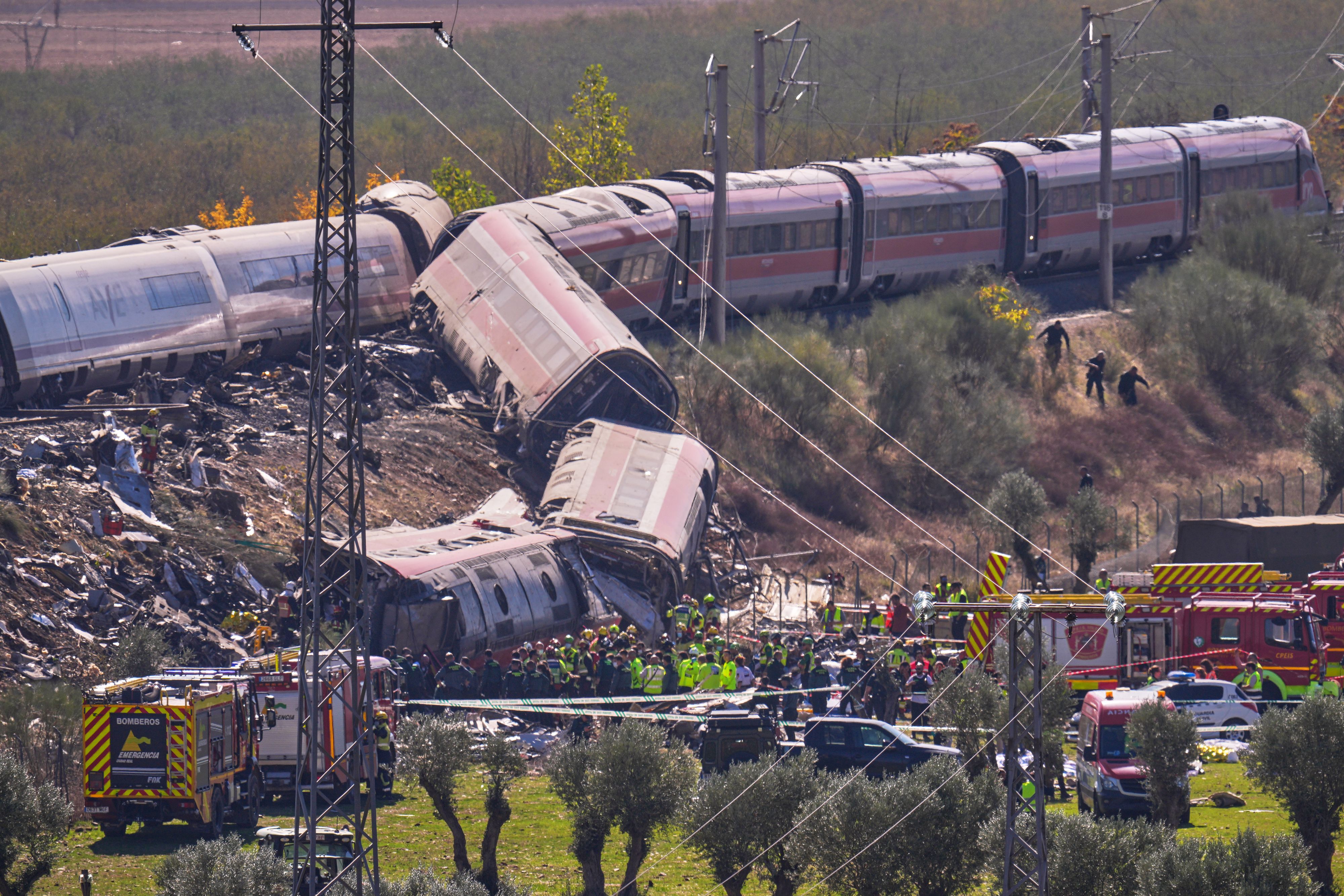 Emergency services work at the scene of a collision between two trains in Urda, Spain, on Wednesday, Oct. 28, 2026. (AP Photo/Manu Fernandez)