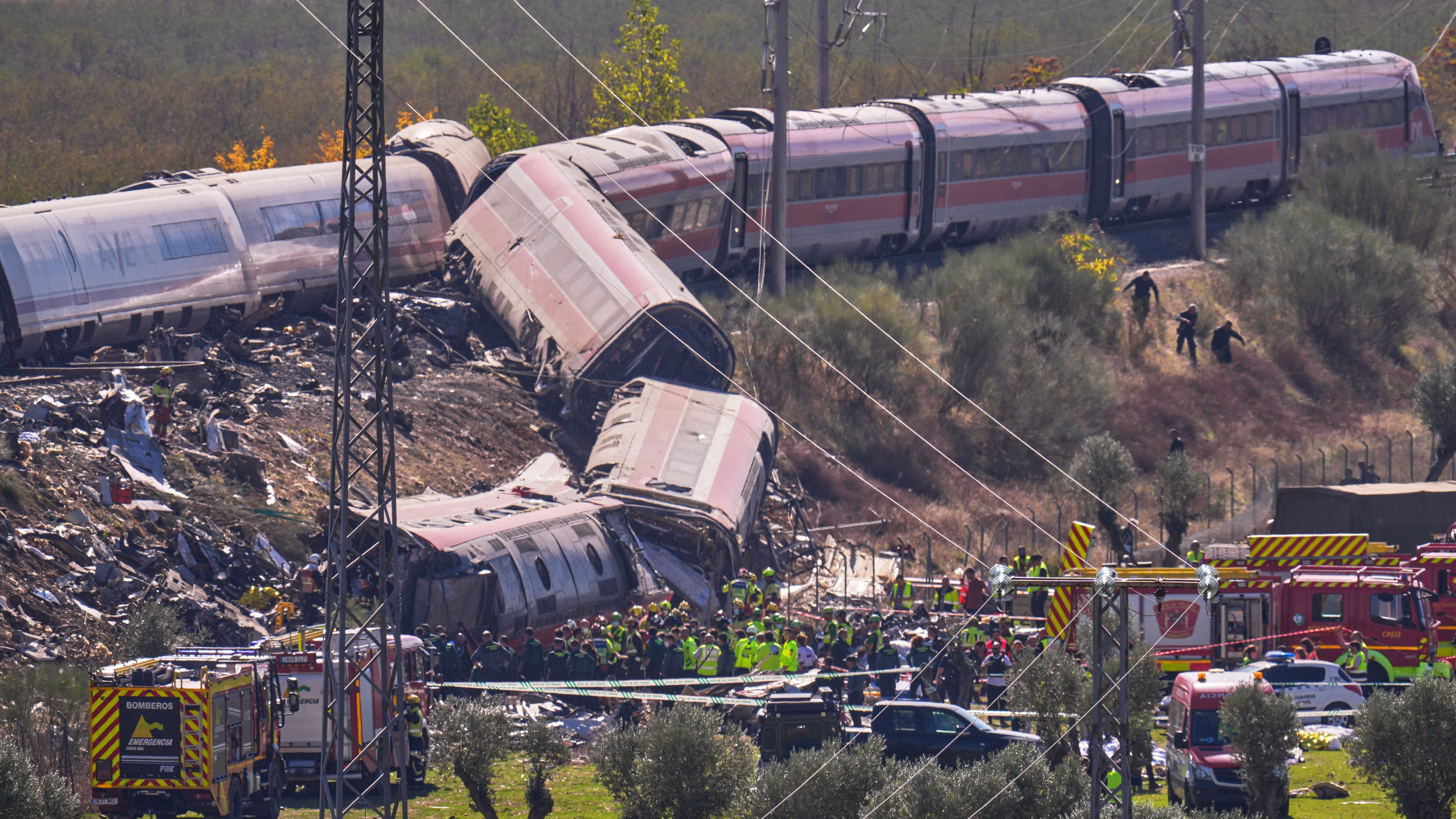 Emergency services work at the scene of a collision between two trains in Urda, Spain, on Wednesday, Oct. 28, 2026. (AP Photo/Manu Fernandez)