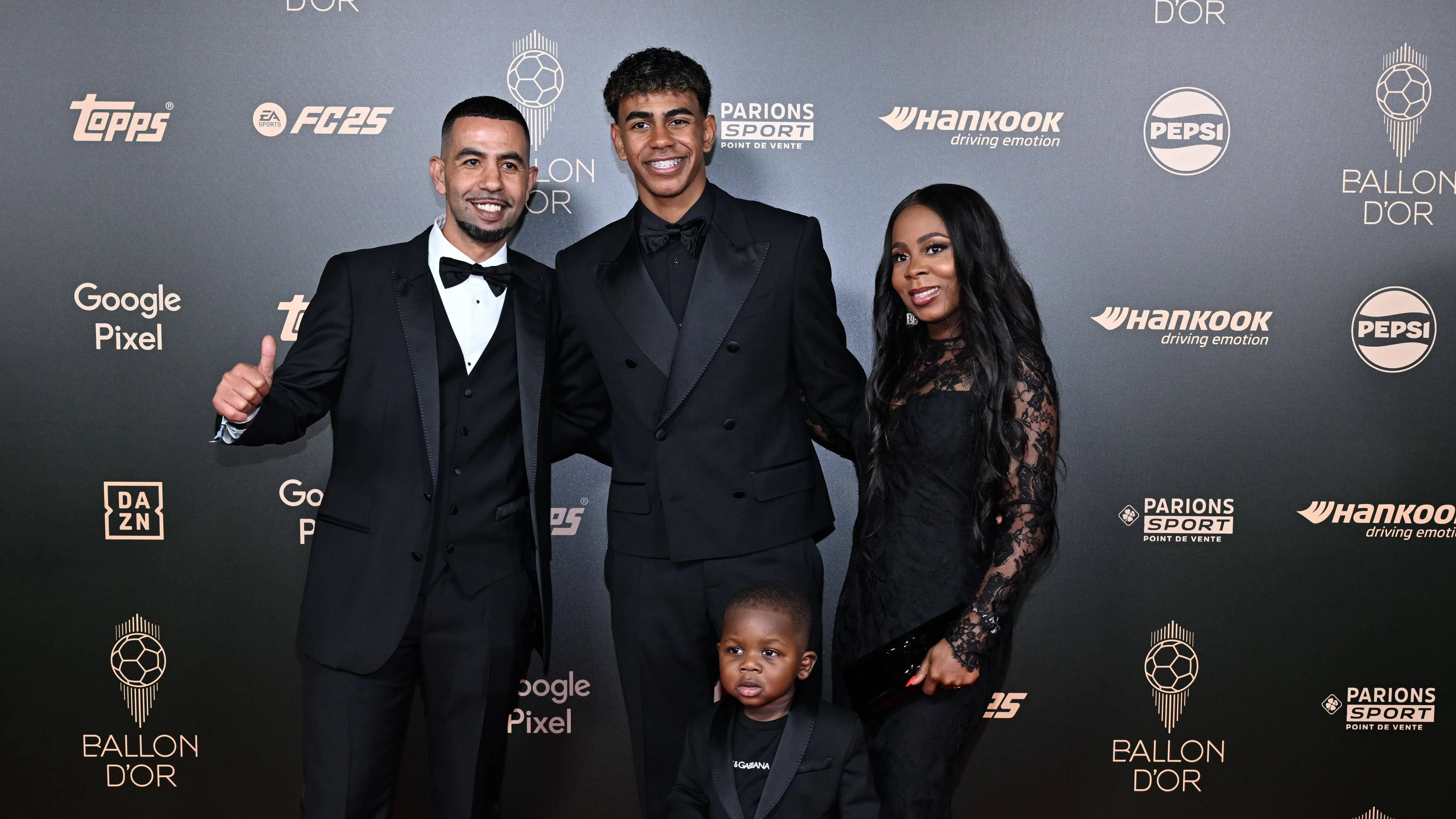 68th Ballon D Or at Theatre Du Chatelet in Paris PARIS, FRANCE - OCTOBER 28: Barcelona s Spanish forward Lamine Yamal and his father Mounir Nasraoui, his mother Sheila Ebana and his younger brother Keyne pose upon arrival to attend the 2024 Ballon d Or France Football award ceremony at the Theatre du Chatelet in Paris on October 28, 2024. France World. Editorial use only. Please get in touch for any other usage. PUBLICATIONxNOTxINxTURxUSAxCANxUKxJPNxITAxFRAxAUSxESPxBELxKORxRSAxHKGxNZL Copyright: x2025xAnadoluxMustafaxYalcÄnx