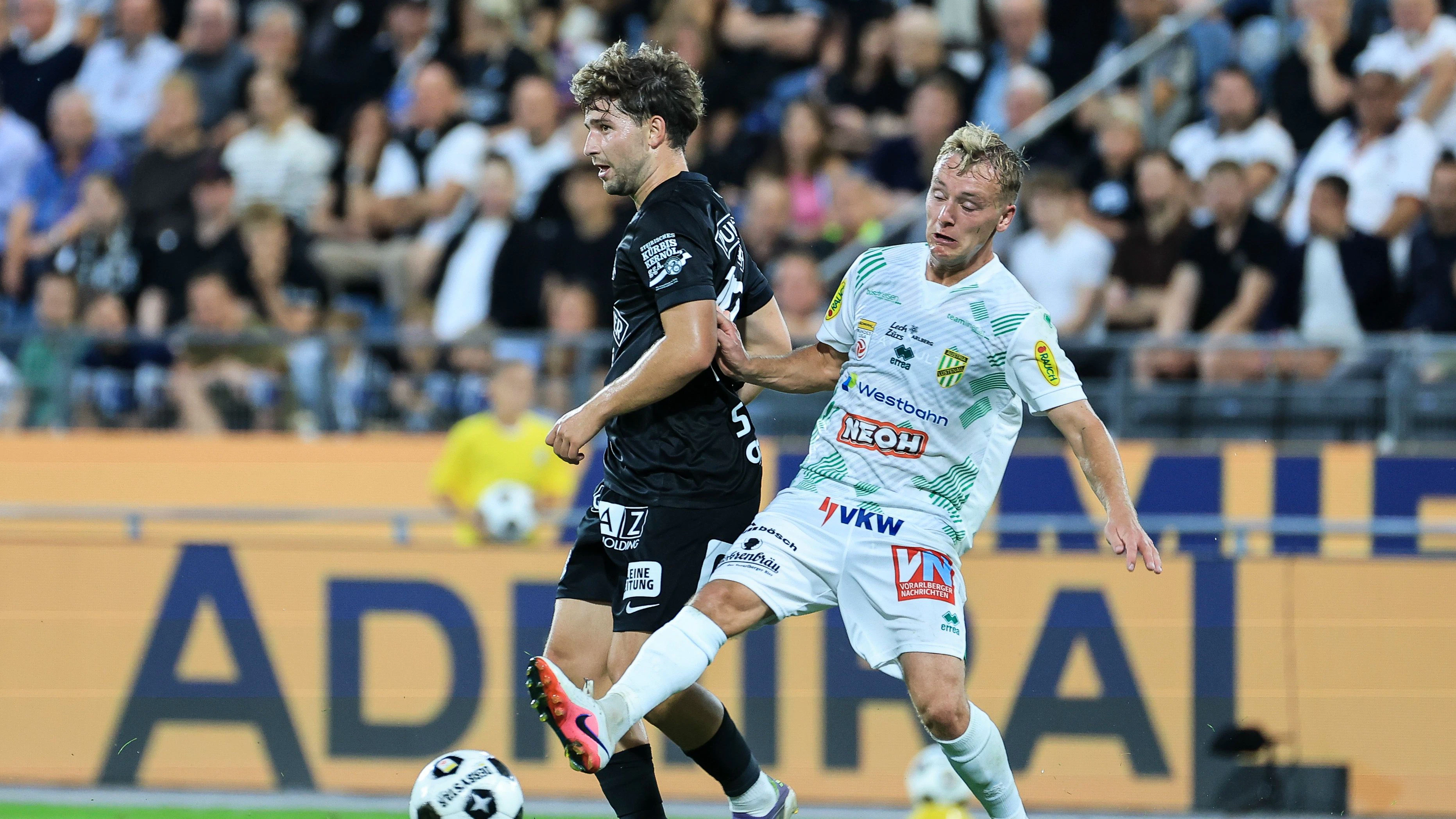 GRAZ,AUSTRIA,22.AUG.26 - SOCCER - ADMIRAL Bundesliga, SK Sturm Graz vs SC Austria Lustenau. Image shows Seedy Jatta (Sturm) and Fabian Gmeiner (A.Lustenau). Photo: GEPA pictures/ Wolfgang Grebien