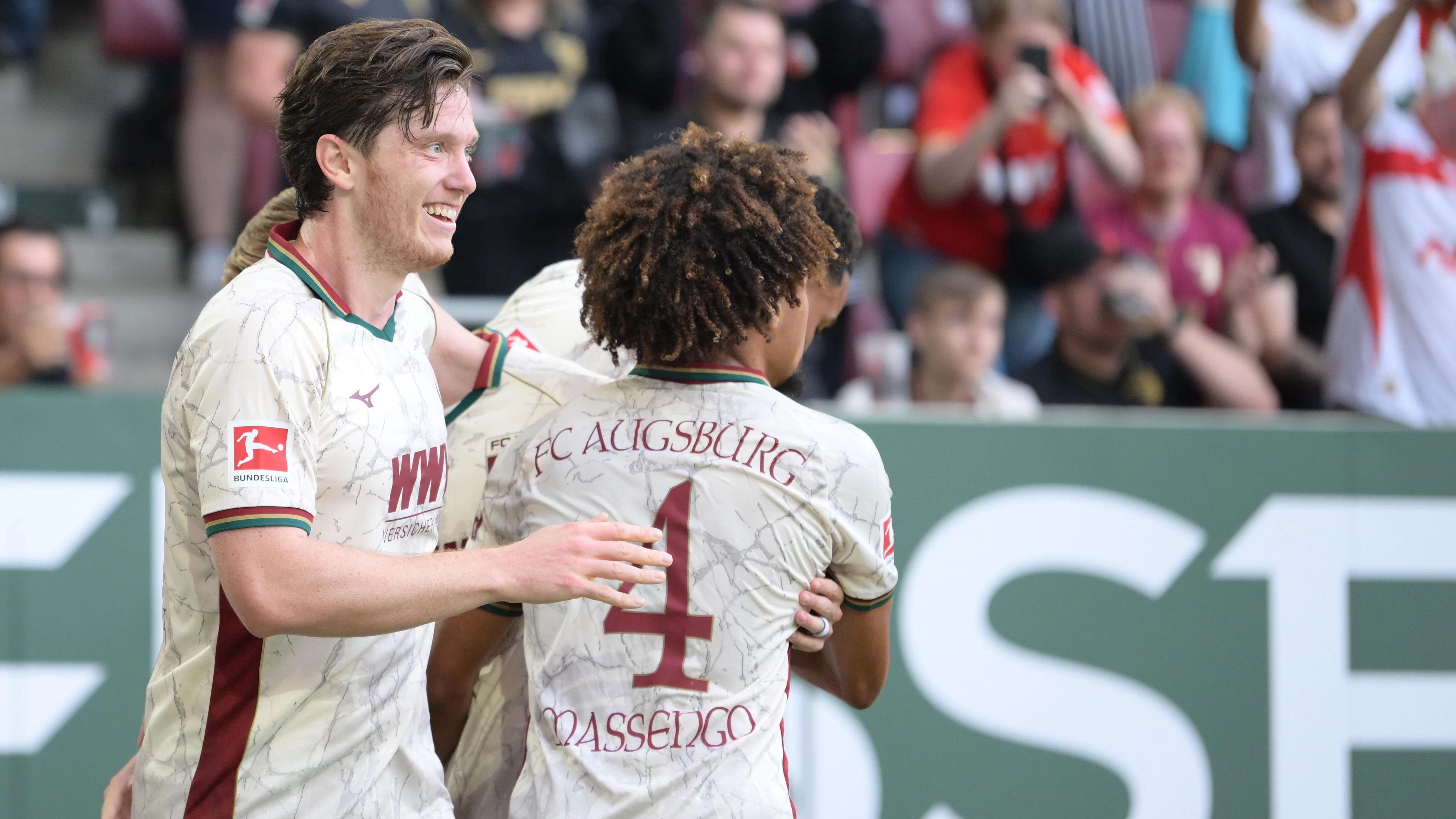AUGSBURG,GERMANY,30.AUG.26 - SOCCER - 1. DFL, 1. Deutsche Bundesliga,  FC Augsburg vs FC Schalke 04. Image shows the rejoicing of Michael Gregoritsch and Han-Noah Massengo (Augsburg) . Photo: GEPA pictures/ Witters/ Markus Fischer - ATTENTION - COPYRIGHT FOR AUSTRIAN CLIENTS ONLY - DFL regulations prohibit any use of photographs as image sequences and/or quasi-video